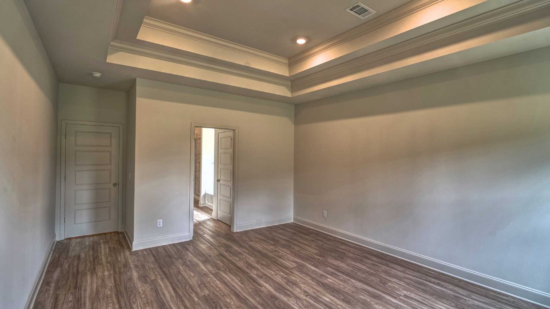 interior bedroom with coffered ceilings