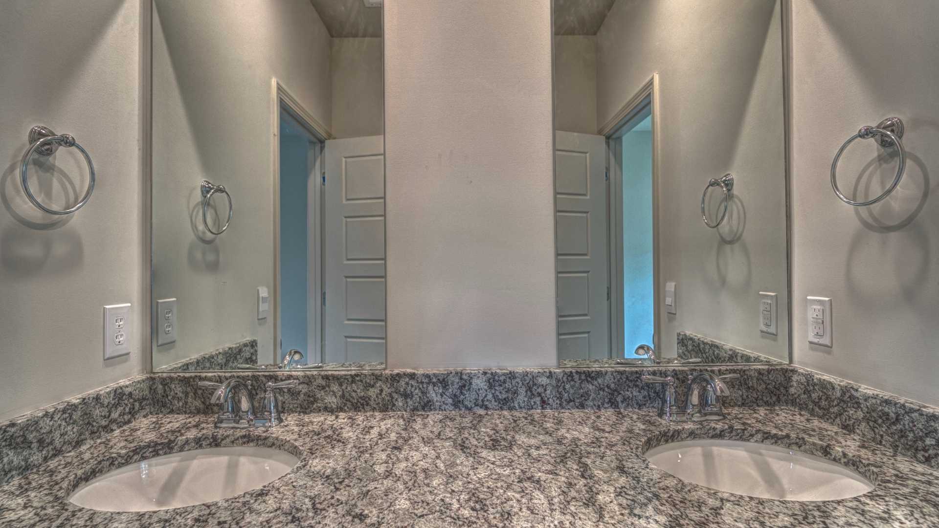 interior bathroom with double sinks