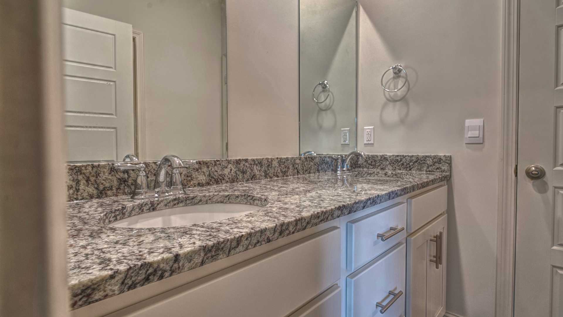 interior bathroom with double sinks