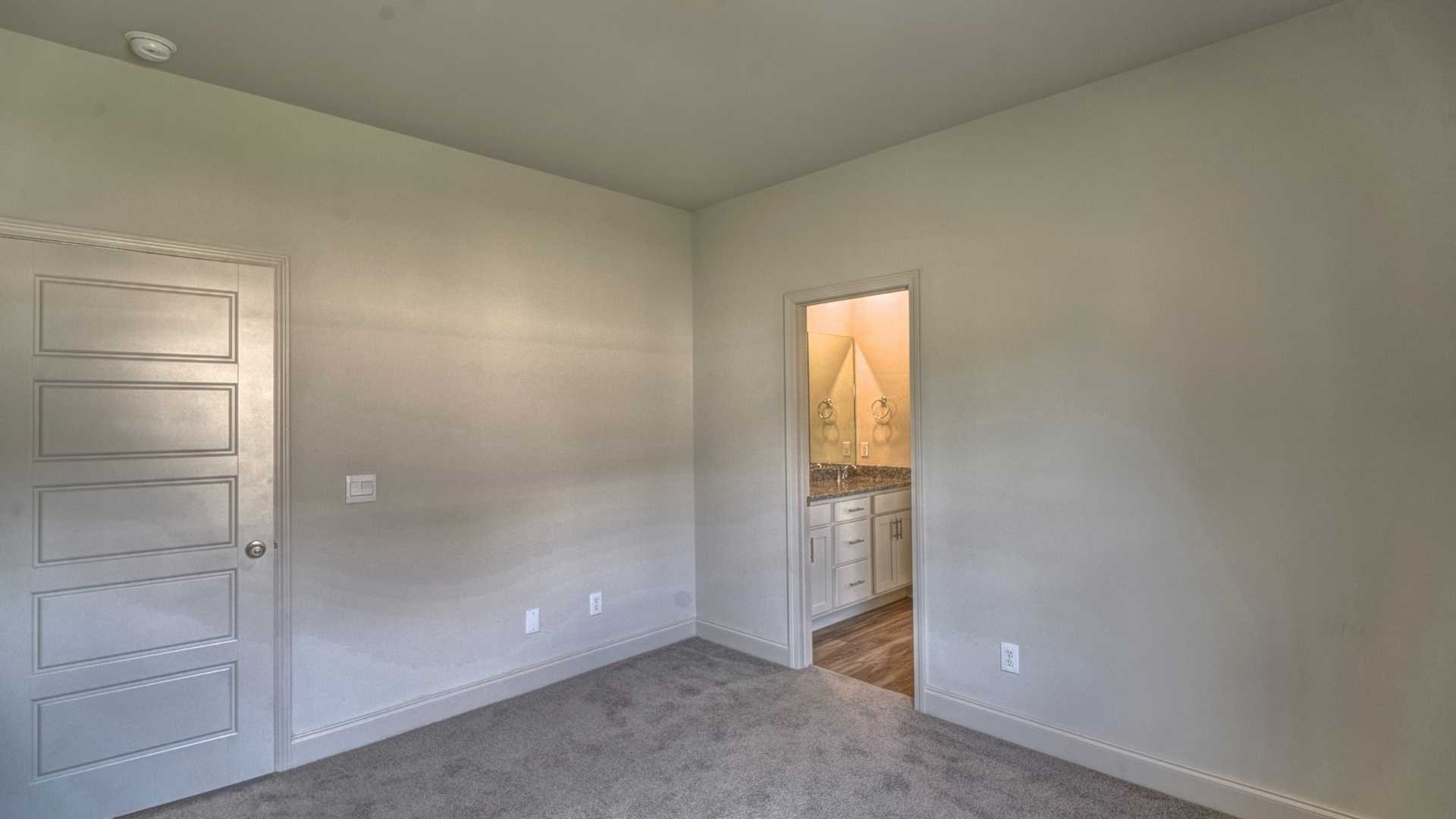 interior bedroom connected to bathroom