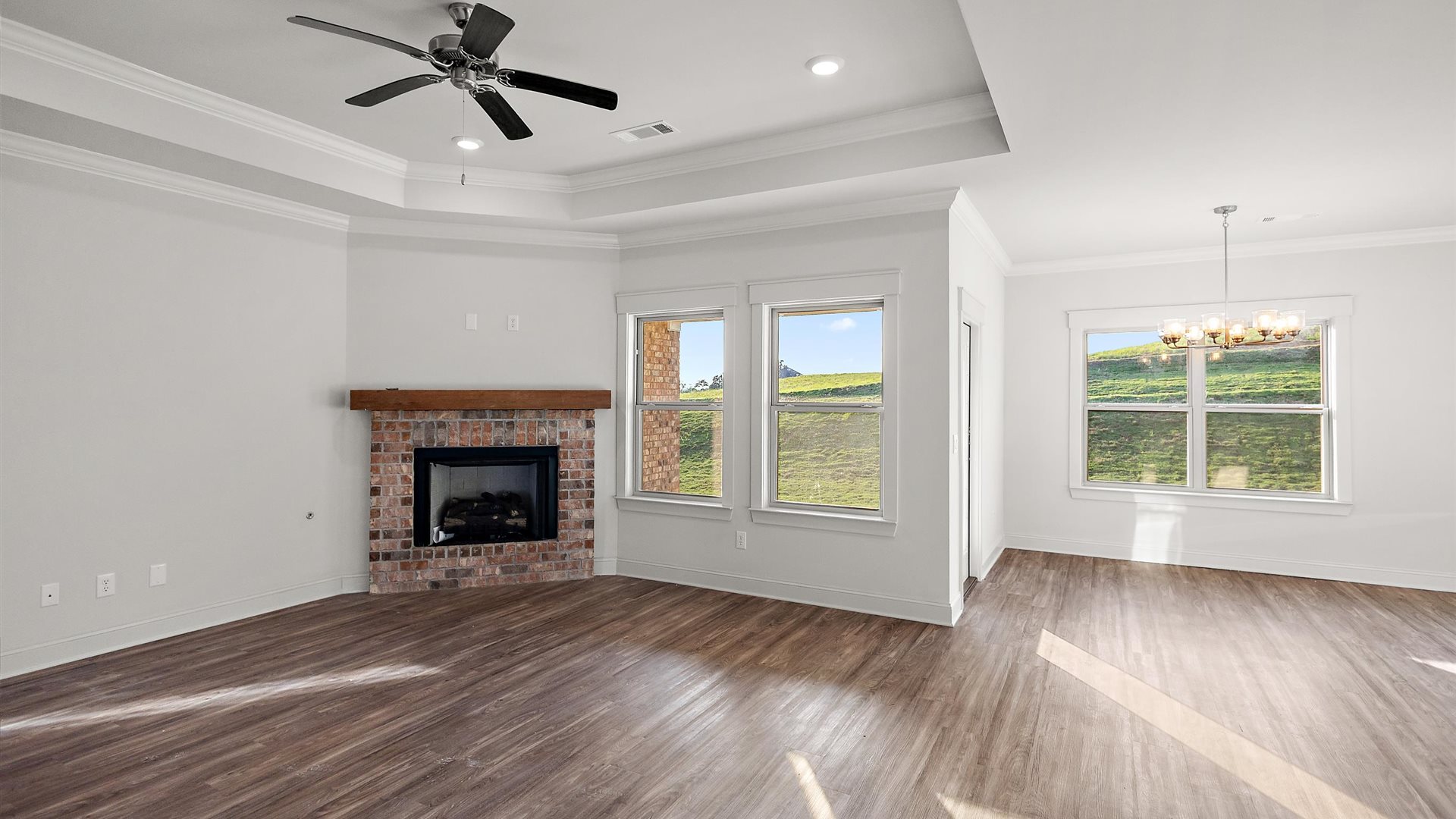 View from kitchen into the dining and living areas, backyard area, showing fresh open design at Cornerstone