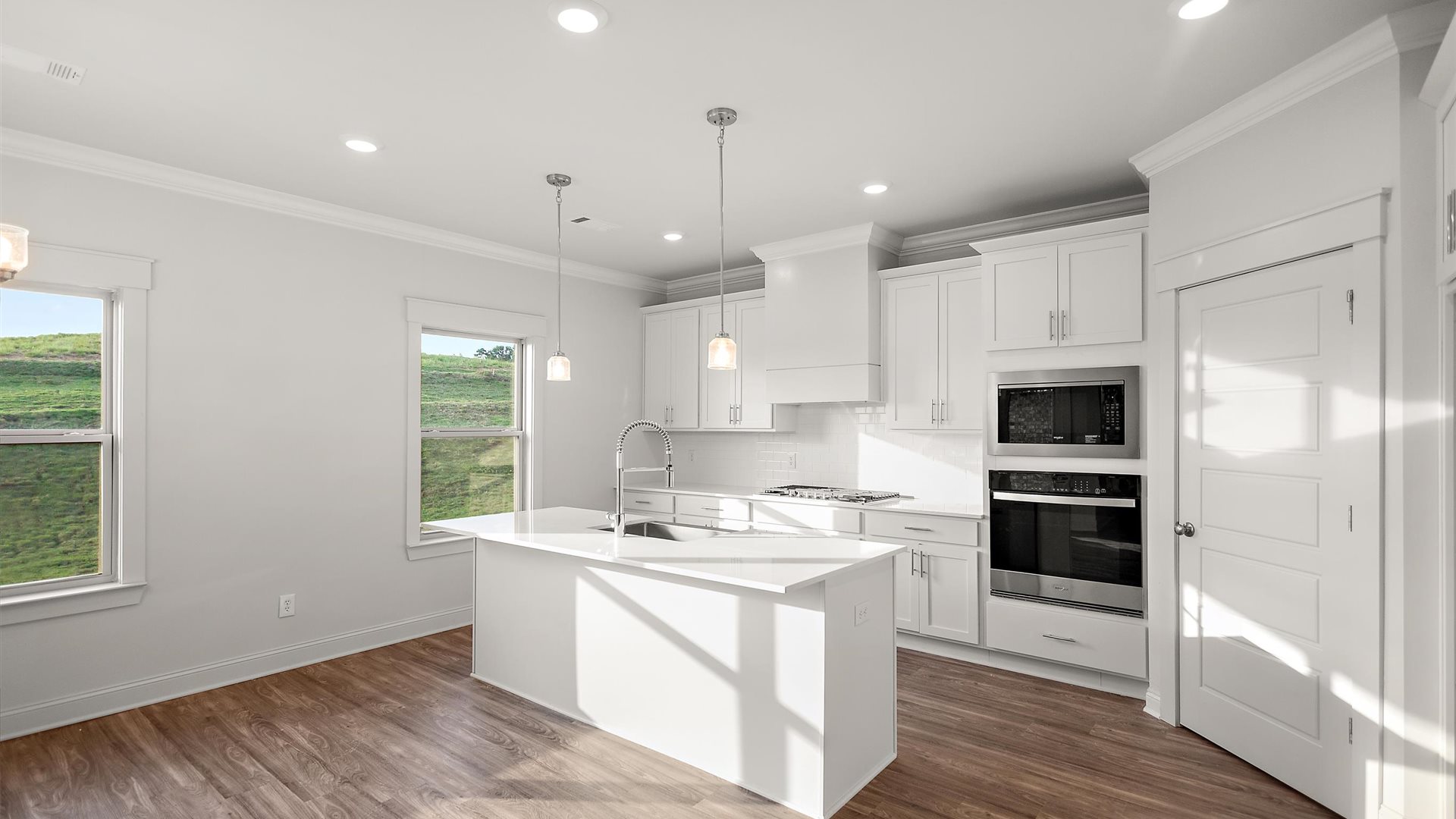 New appliance suite included, our larger kitchen island with seating anchor the kitchen, next to dining, great rooms, pantry