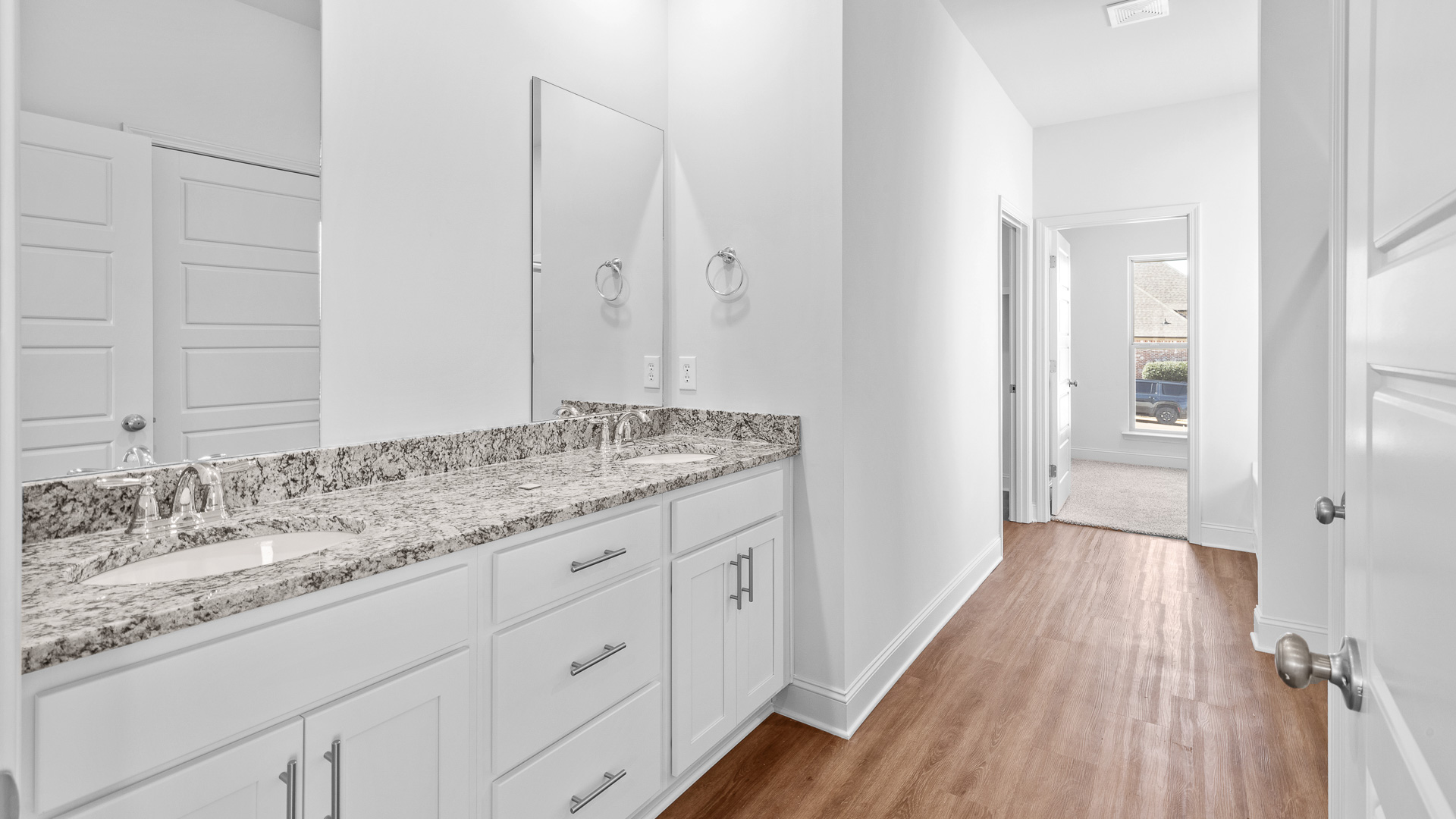 Primary bathroom with double vanity sinks.