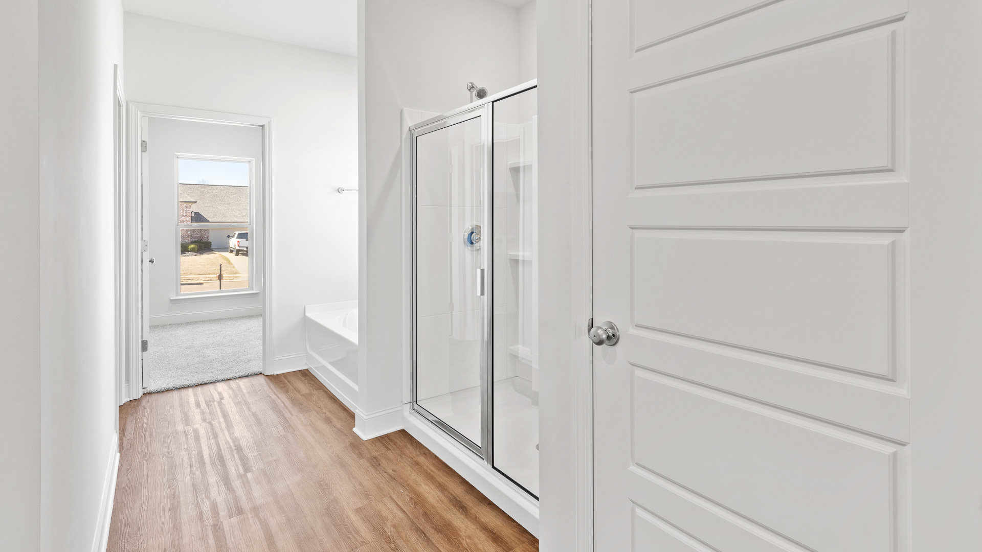 Primary bathroom with separate shower and bathtub.