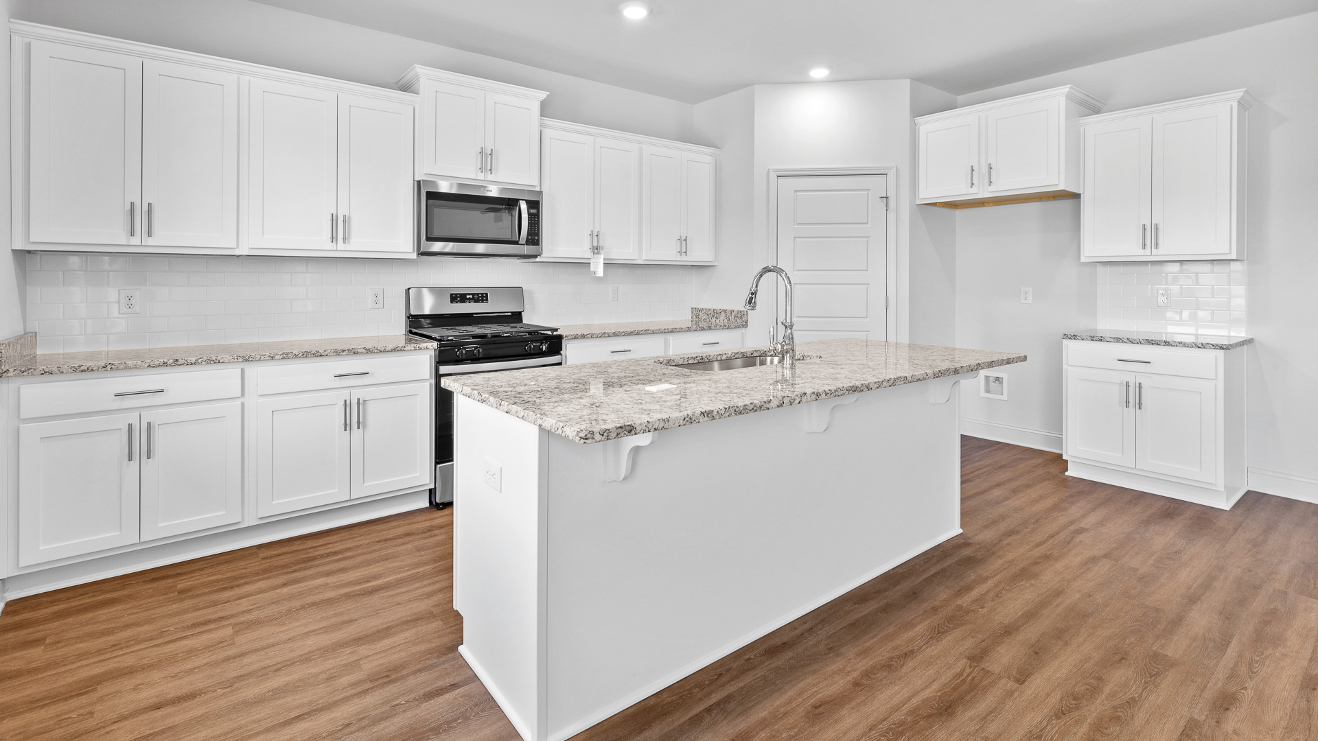 Kitchen with lots of storage space including walk in pantry.