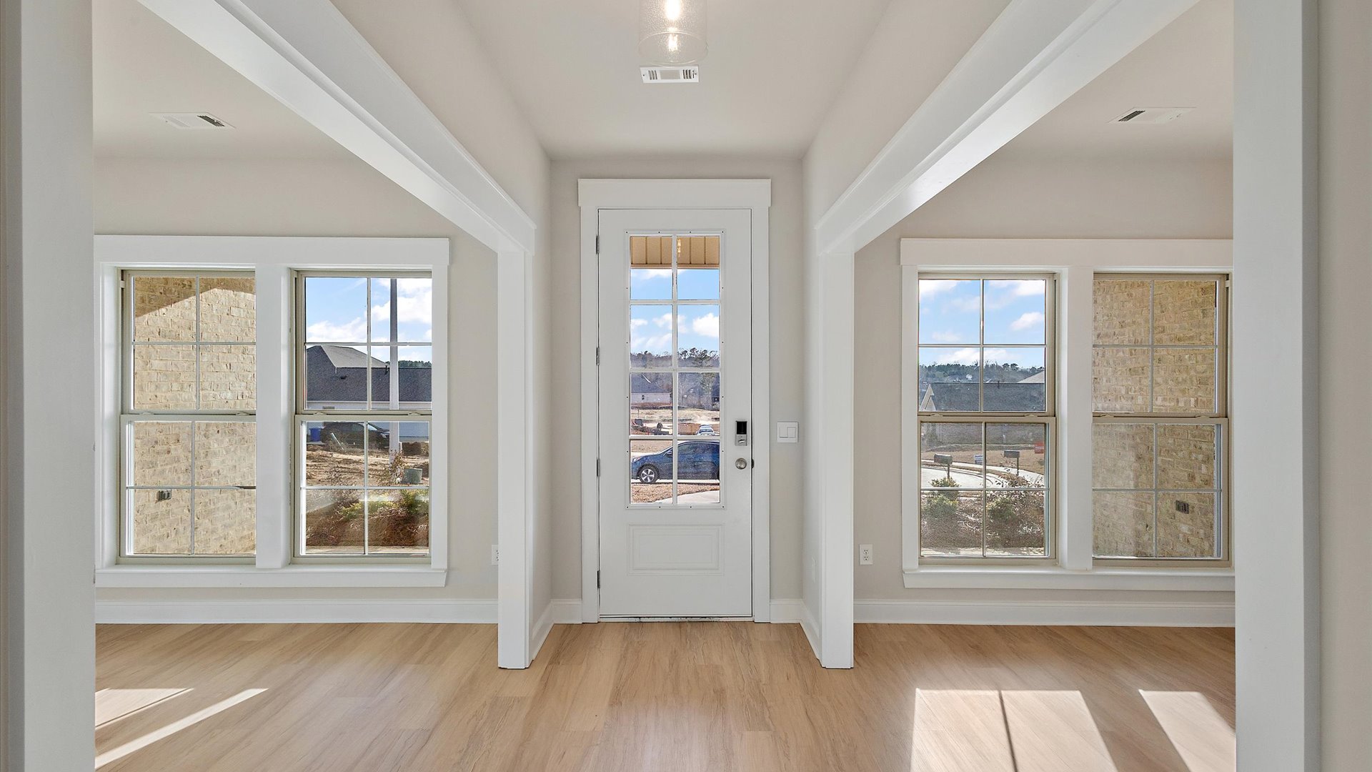 Our new residence front covered door-porch invites you Home to this well-crafted and designed new home