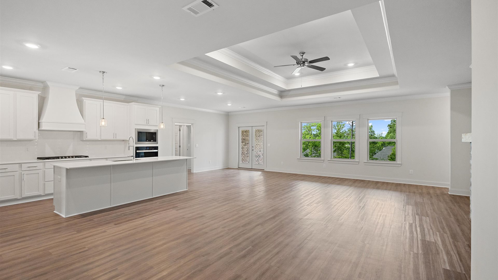 gorgeous living area flowing seamlessly into the modern kitchen