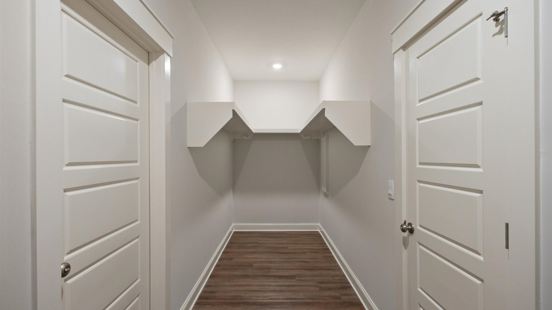Interior walk-in closet with shelving