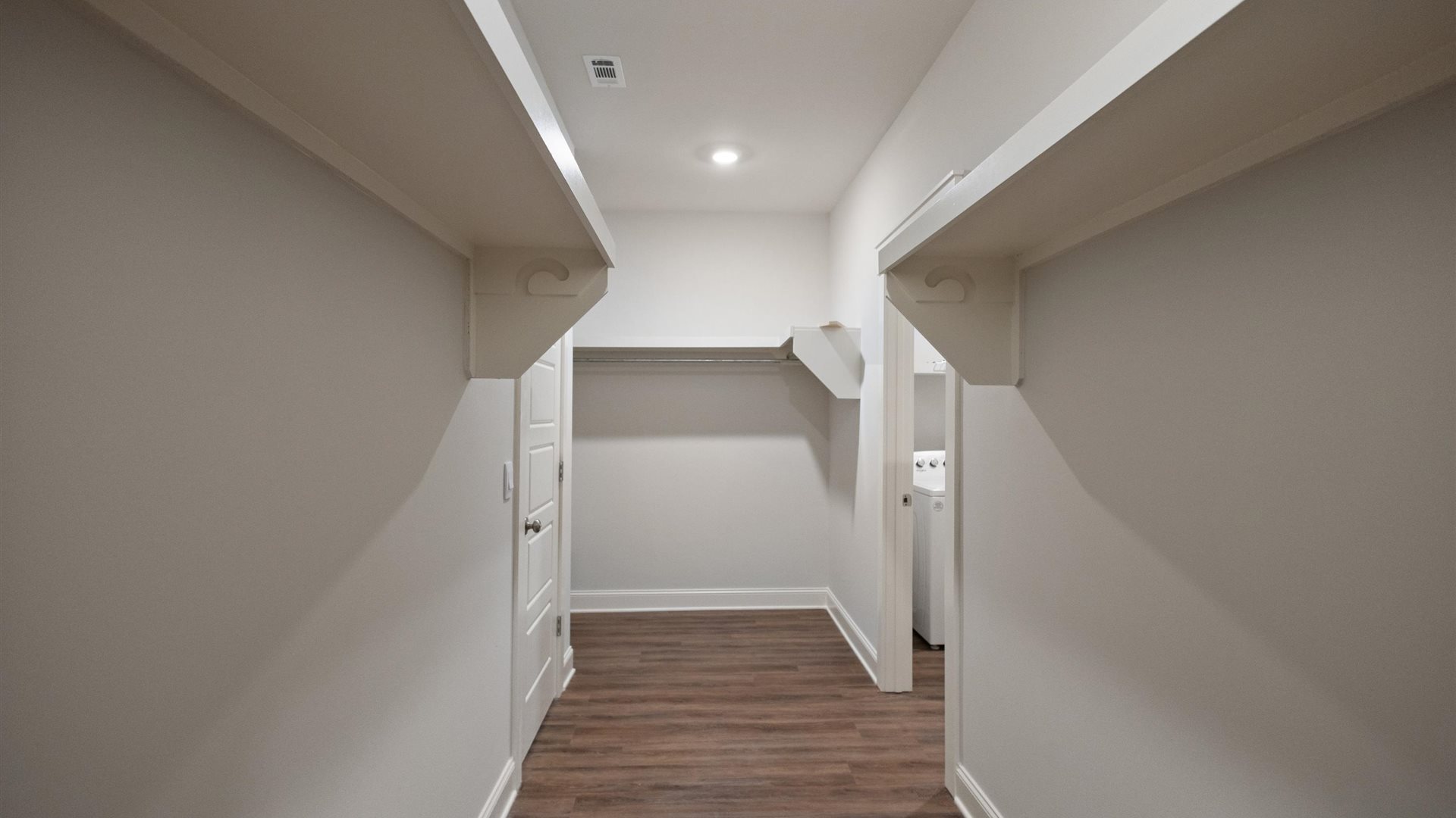 Interior walk-in closet with shelving