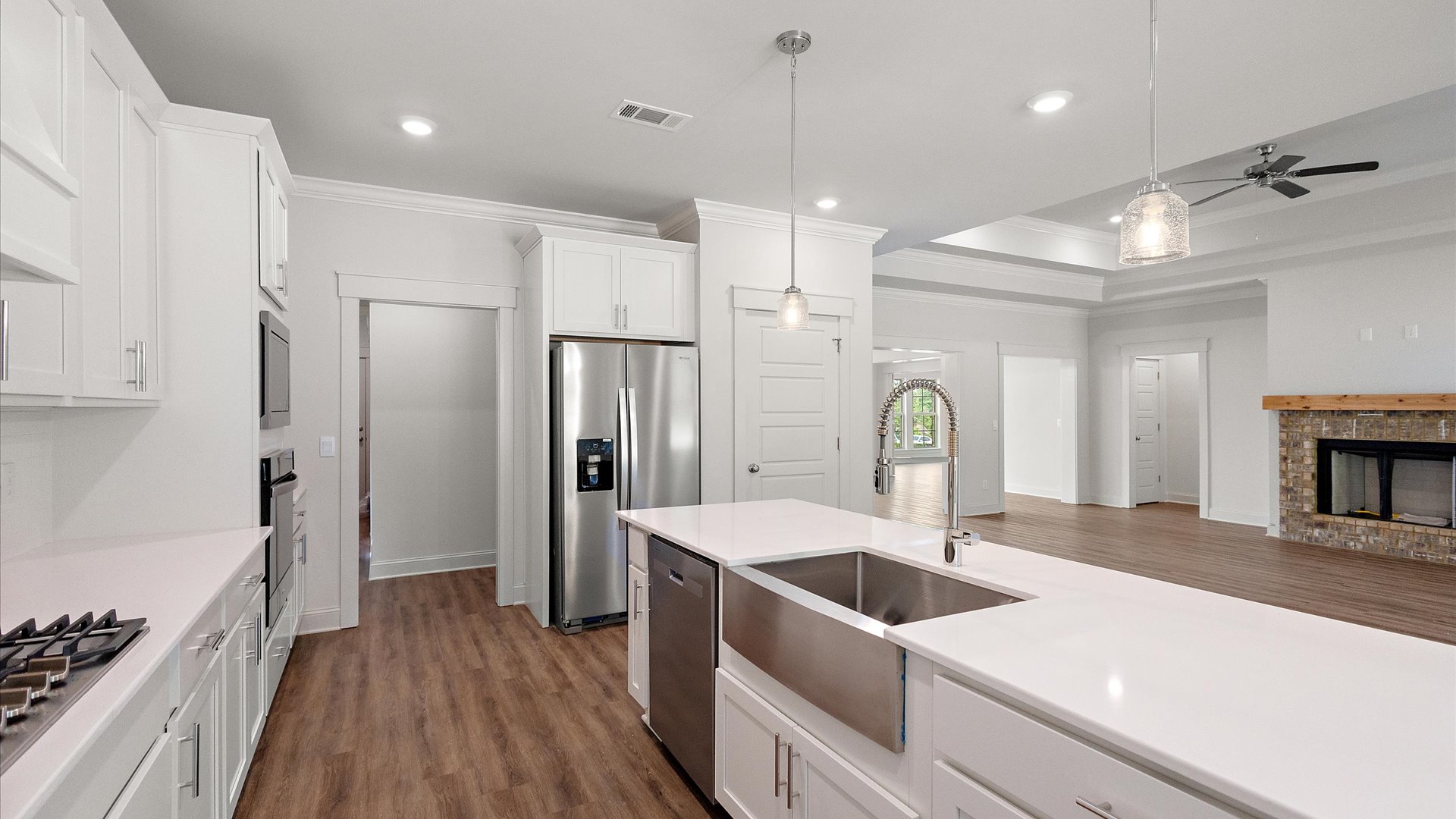 interior kitchen with white cabinets and central island