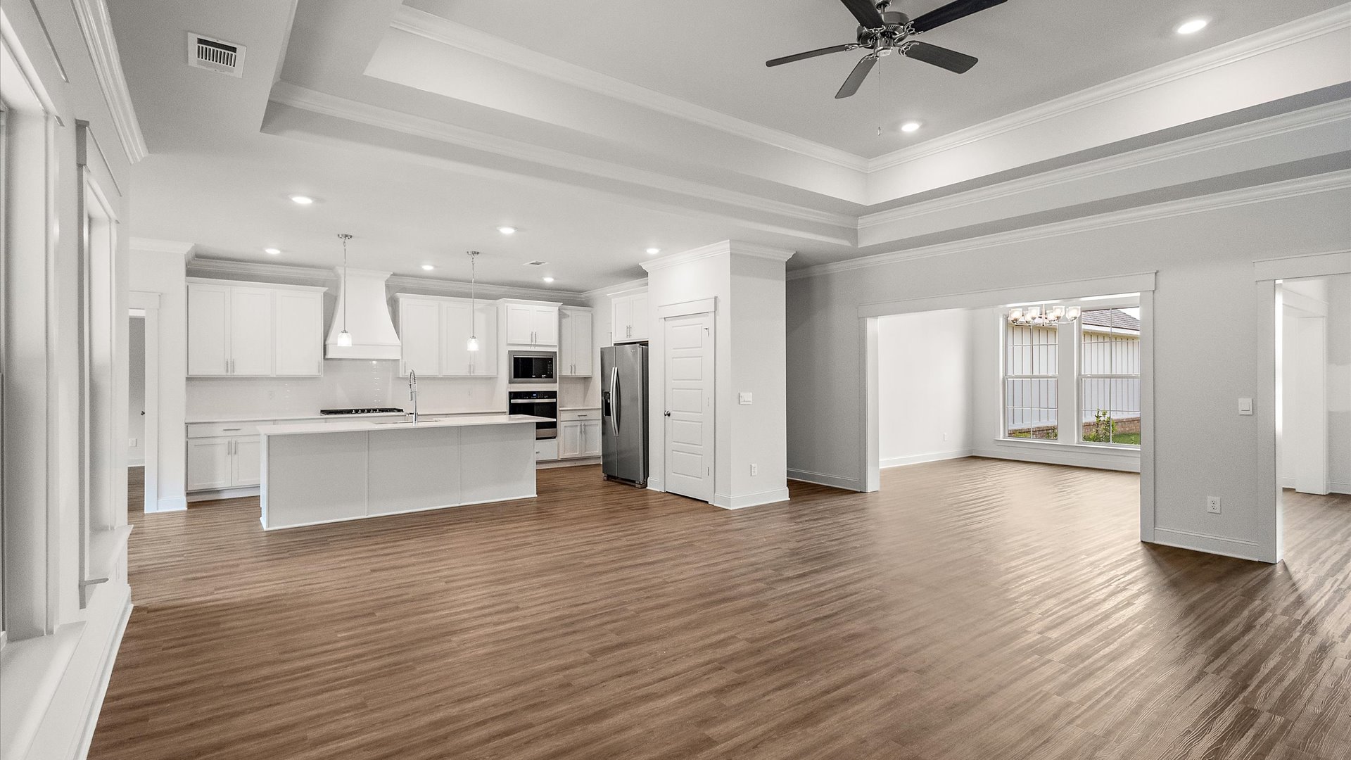 Interior living room open to dining room and kitchen