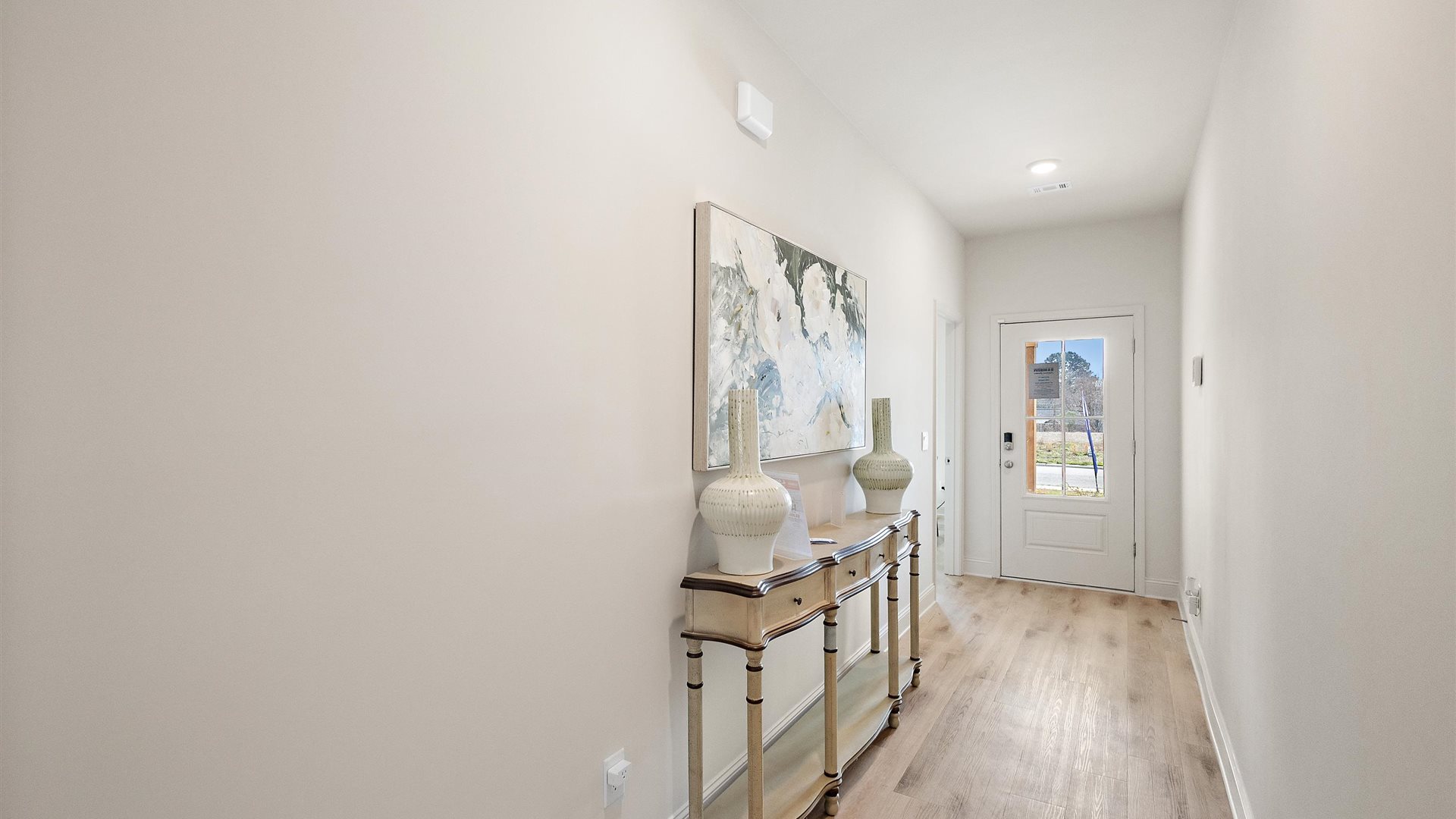 Horseshoe Bend foyer, entry hallway inside front door, next to flex-office, sitting room, half bath adds a welcoming direct line of sight home
