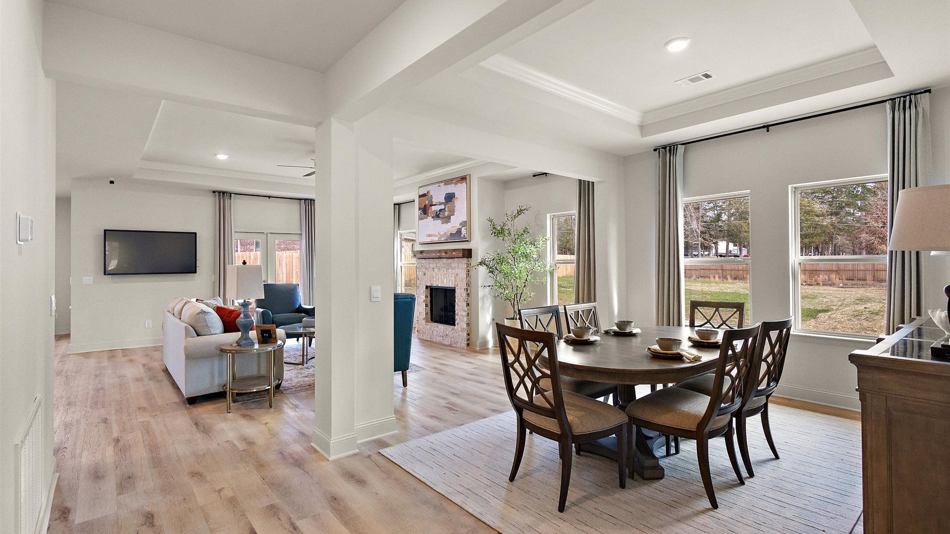 Horseshoe Bend living room with views into dining, kitchen, and outside access brings flow to your home adding connectivity