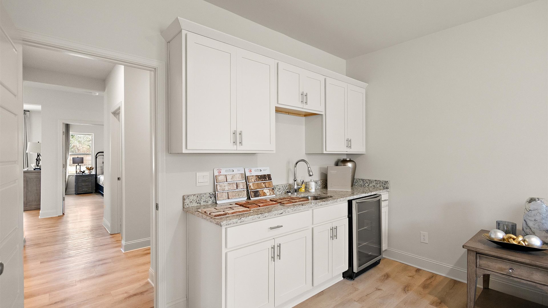 Central kitchen island with sink and seating, appliance suite included, prep zones and pantry access Horseshoe Bend