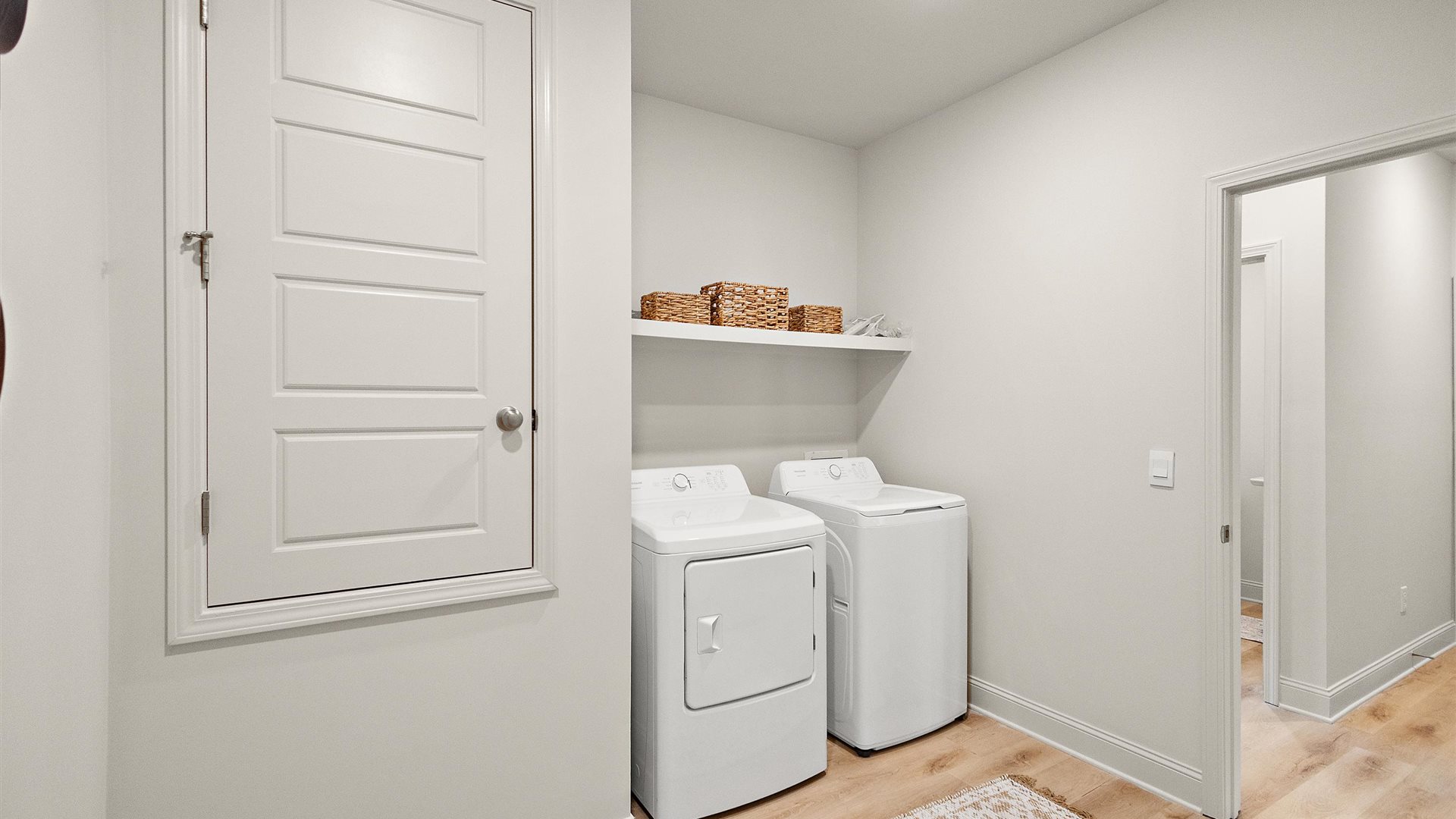 Our Utility laundry smartly designed with overhead storage, a drop zone, washer, dryer and hookups included Horseshoe Bend model