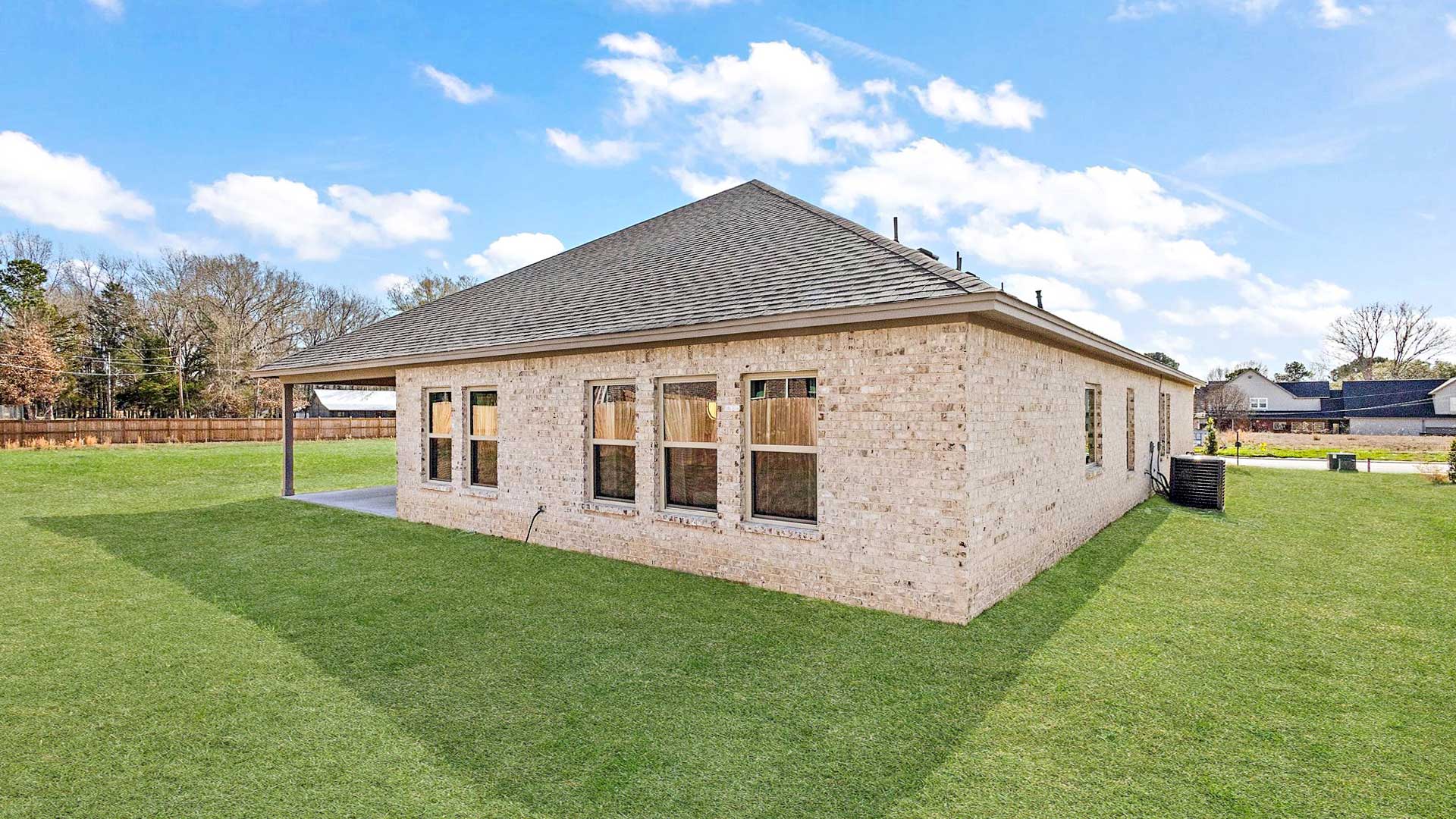 Outside with covered concrete patio offering seating space and grilling areaHorseshoe Bend By D.R. Horton