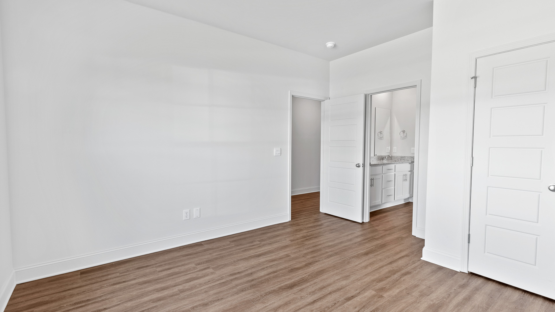 additional bedroom with hardwood floors