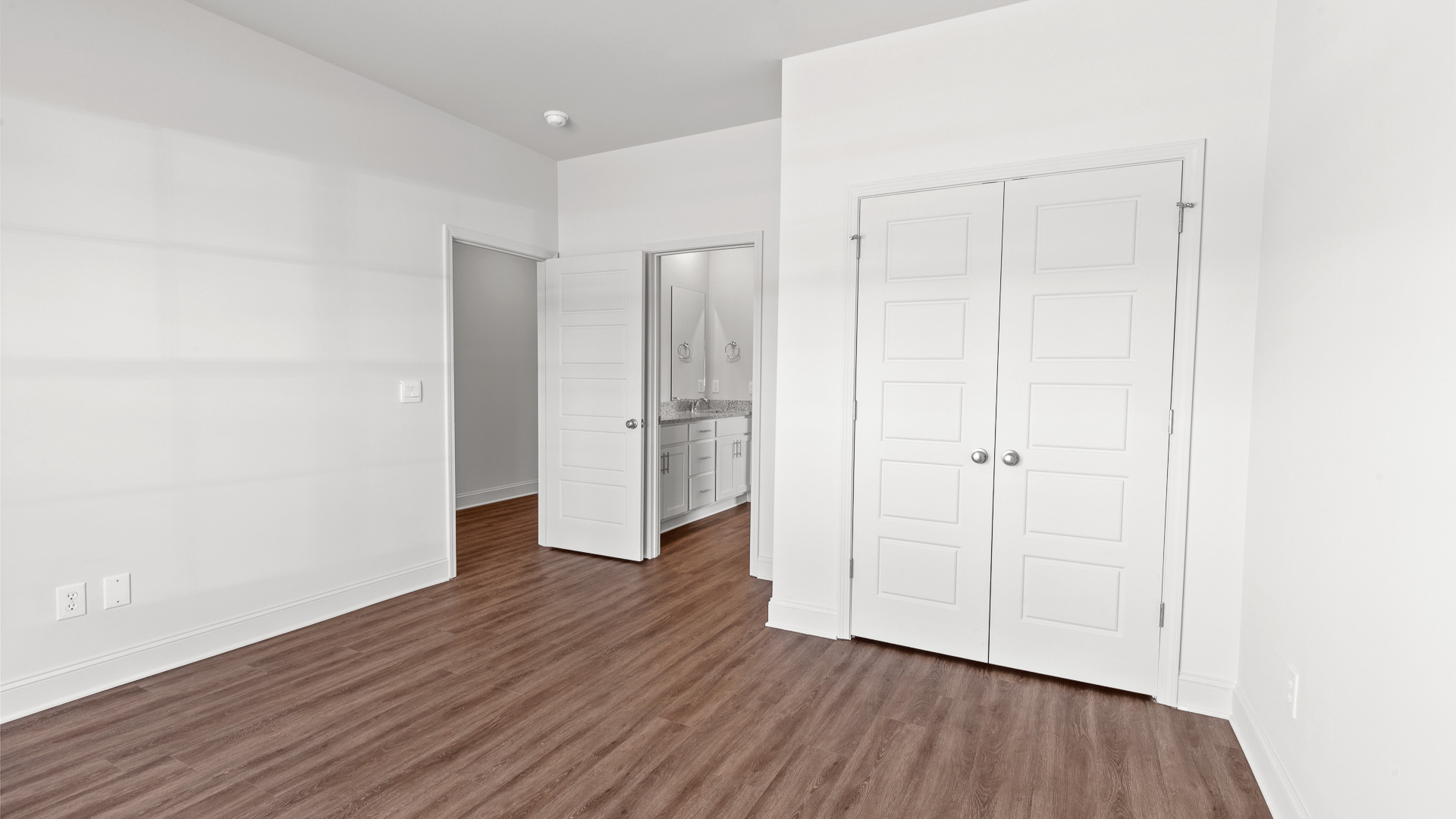 additional bedroom with hardwood floors