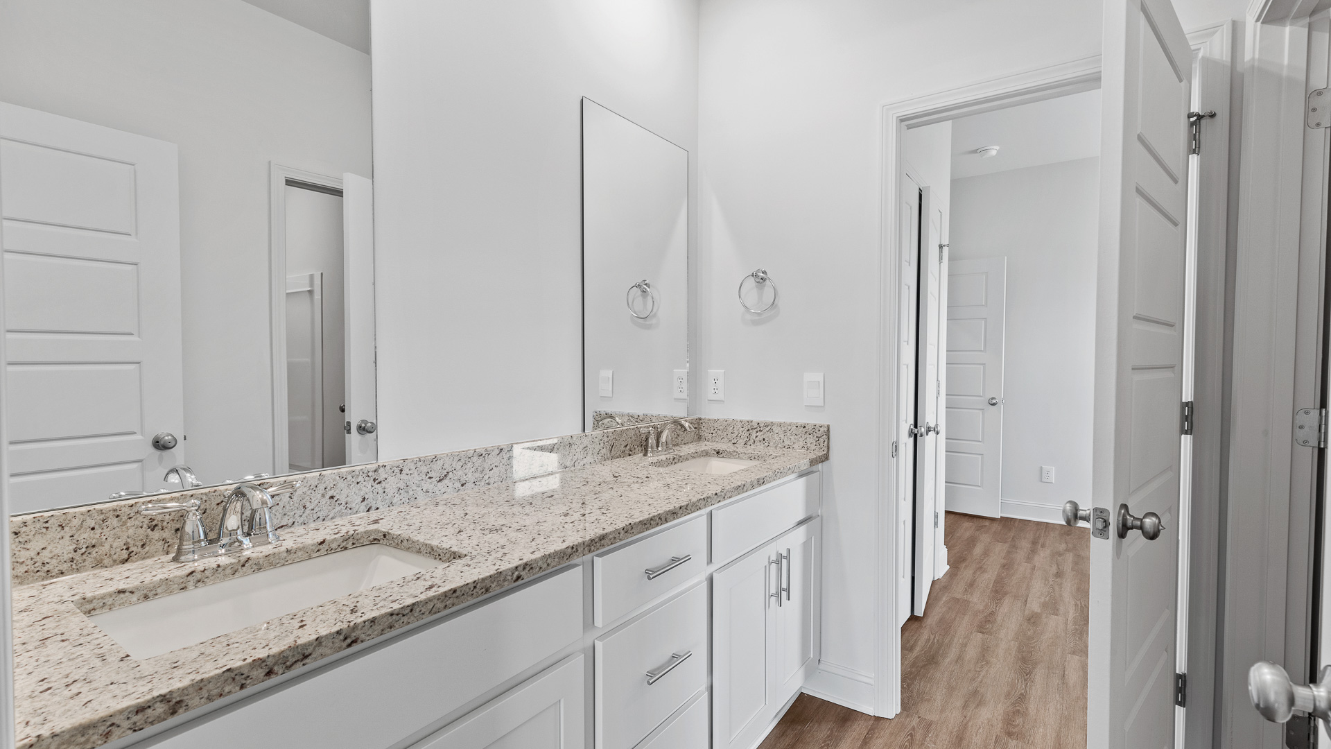 double vanity, granite countertops, hardwood floors, and recessed lighting