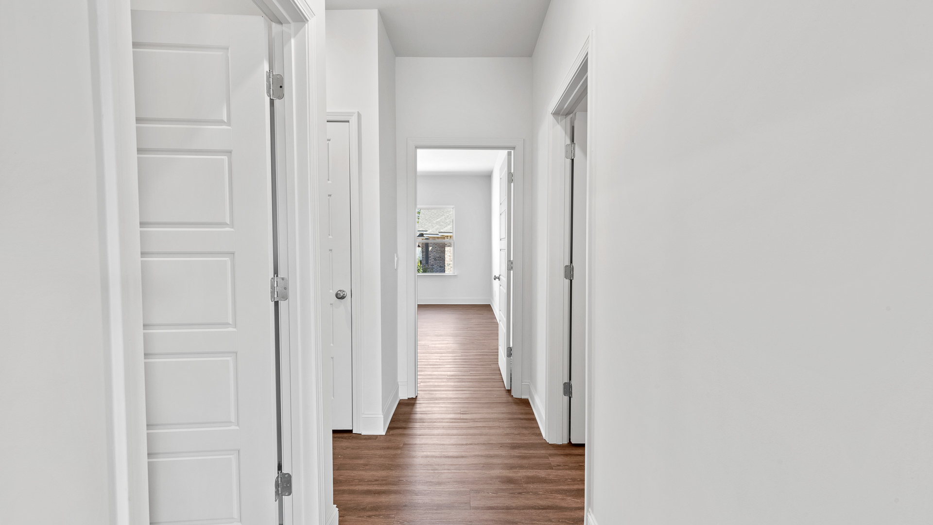 hallway leading to the additional bedrooms