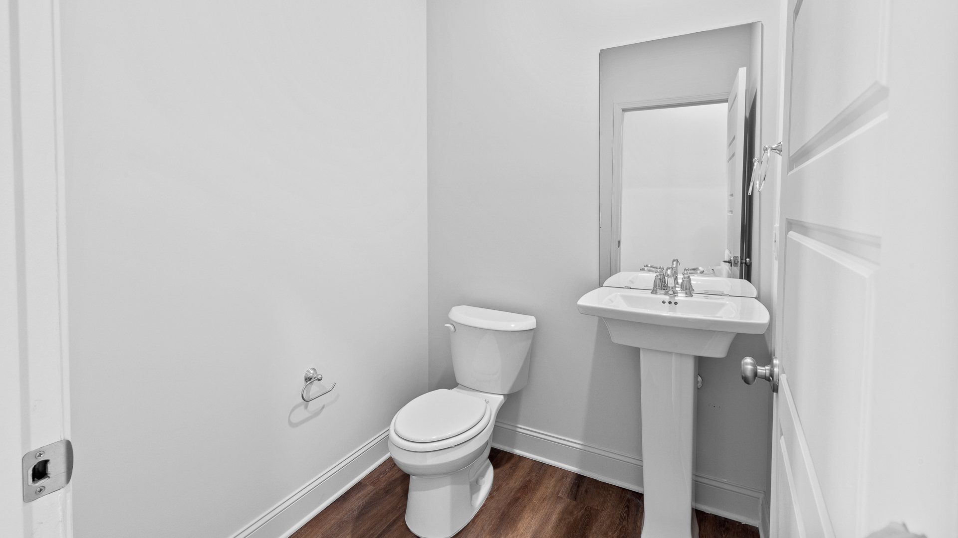 half bathroom with toilet and sink