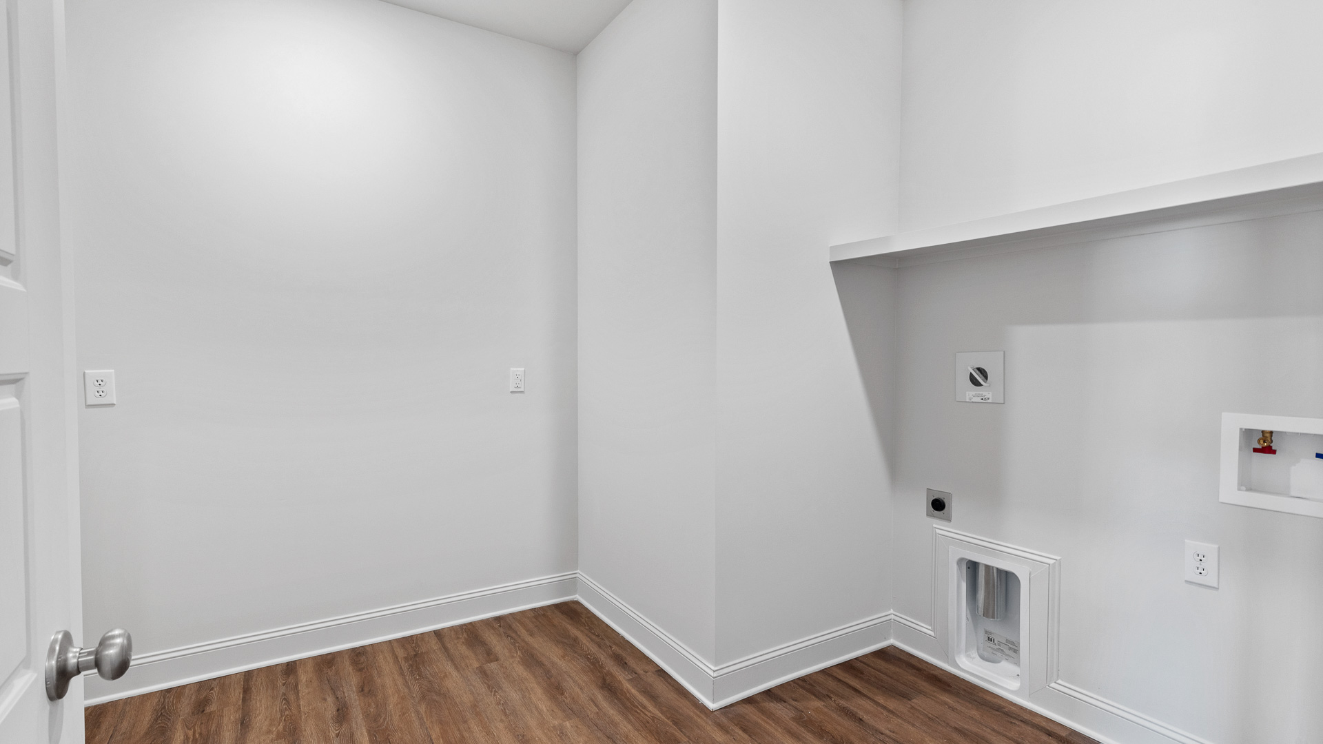 laundry room with wooden shelf for storage
