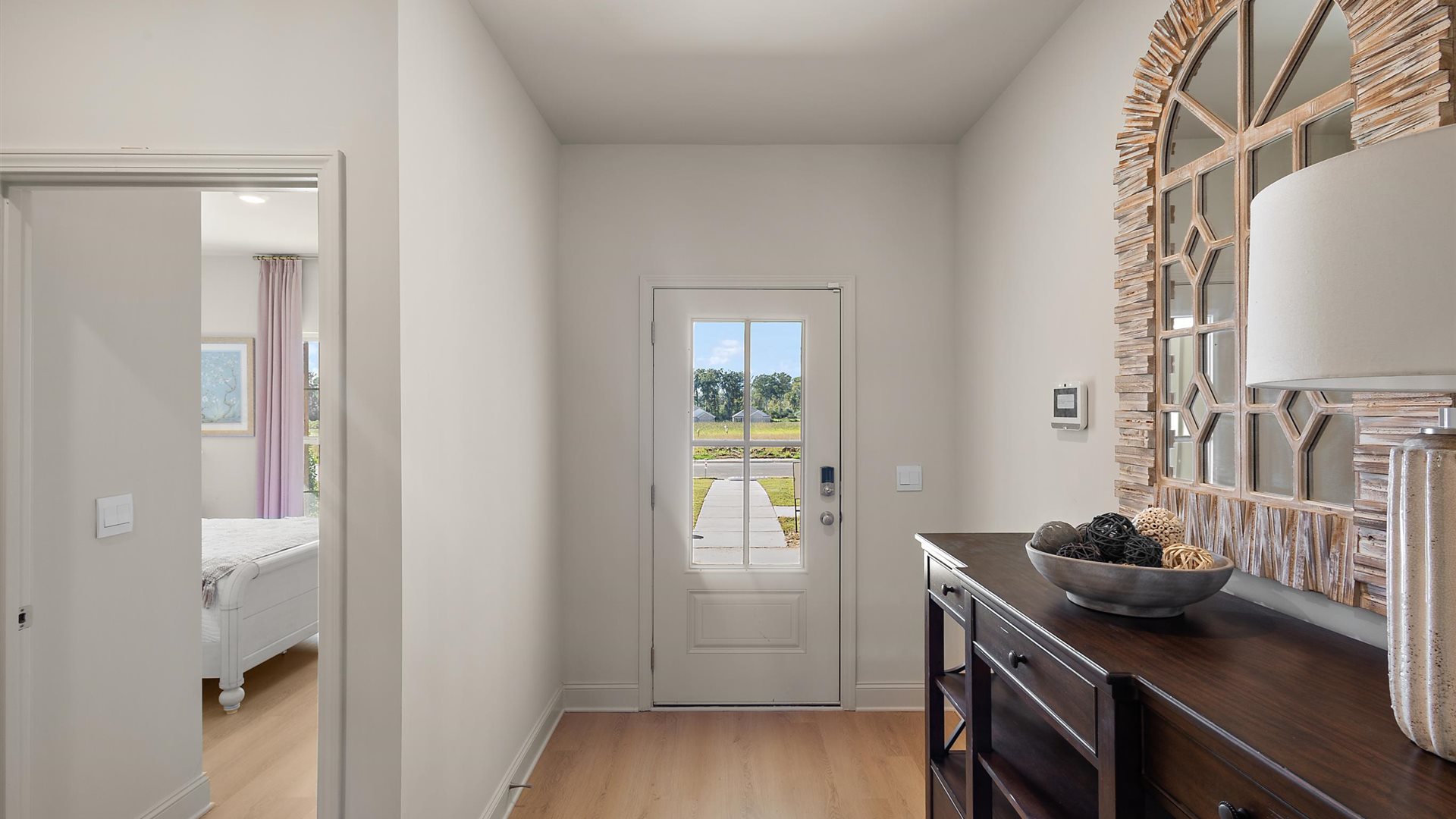 Front entryway and foyer with hardwood flooring