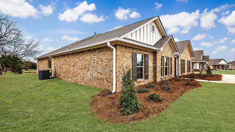 Jasmine single story plan with side entry garage and driveway.