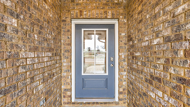 Jasmine single-story home front door.