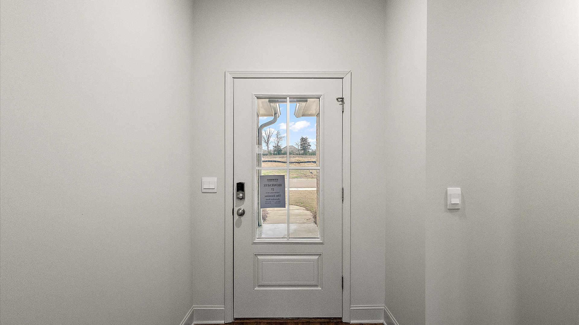 Front door of the home leading into the living space.