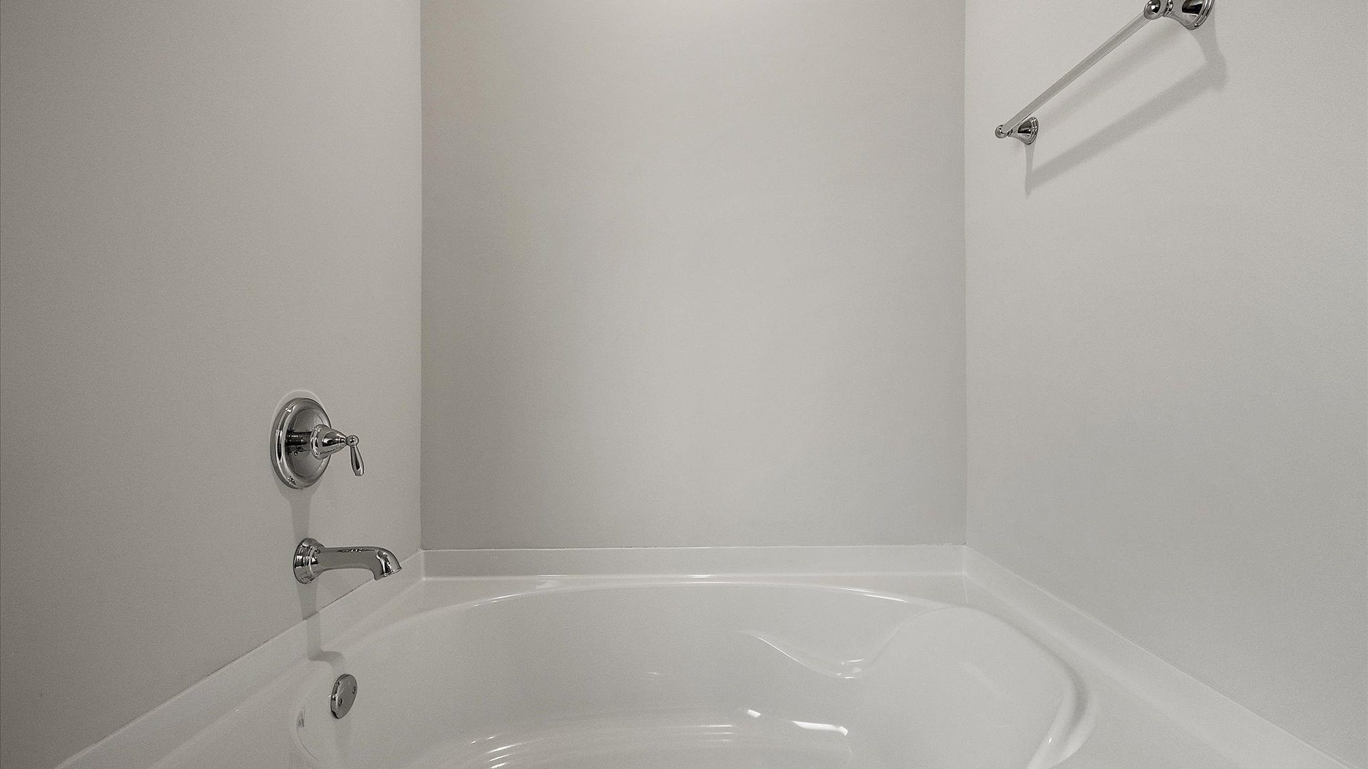 Garden tub with towel rack.