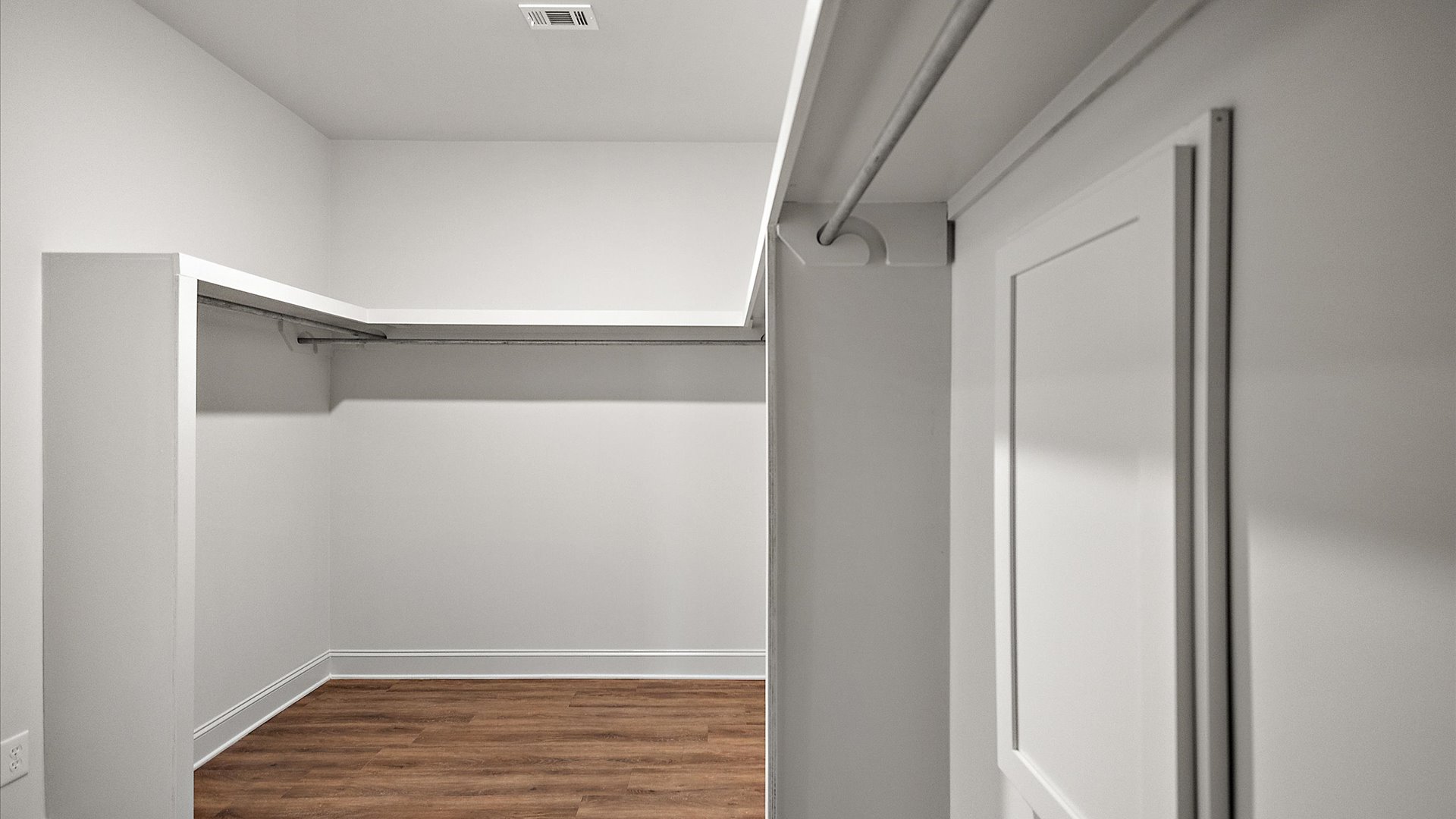 Sizable walk-in closet in primary bathroom.