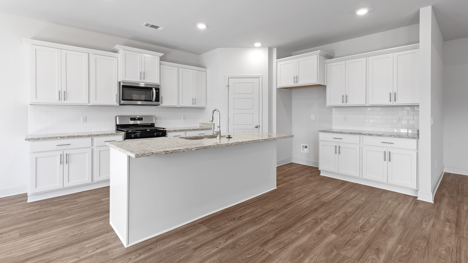 open kitchen with granite countertops and stainless steel appliances