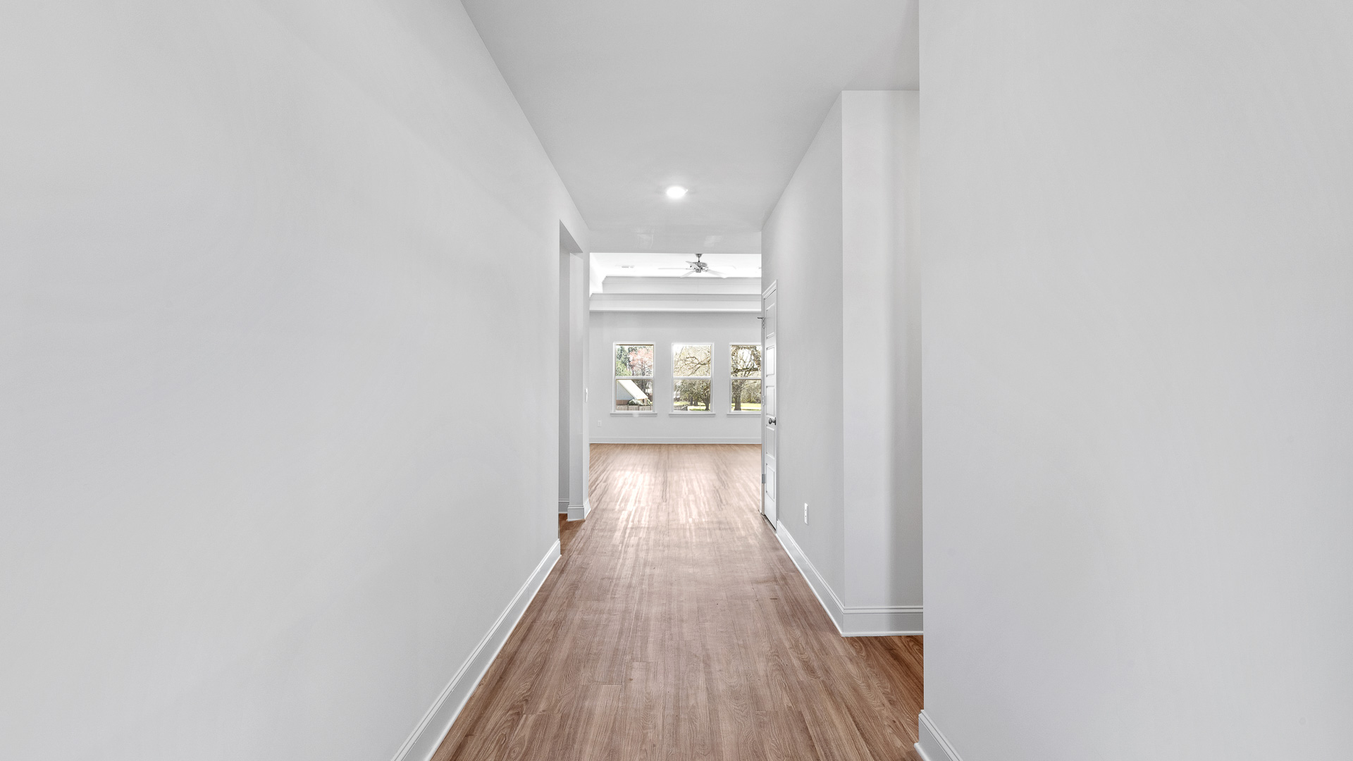 Front entryway and foyer with hardwood floors.