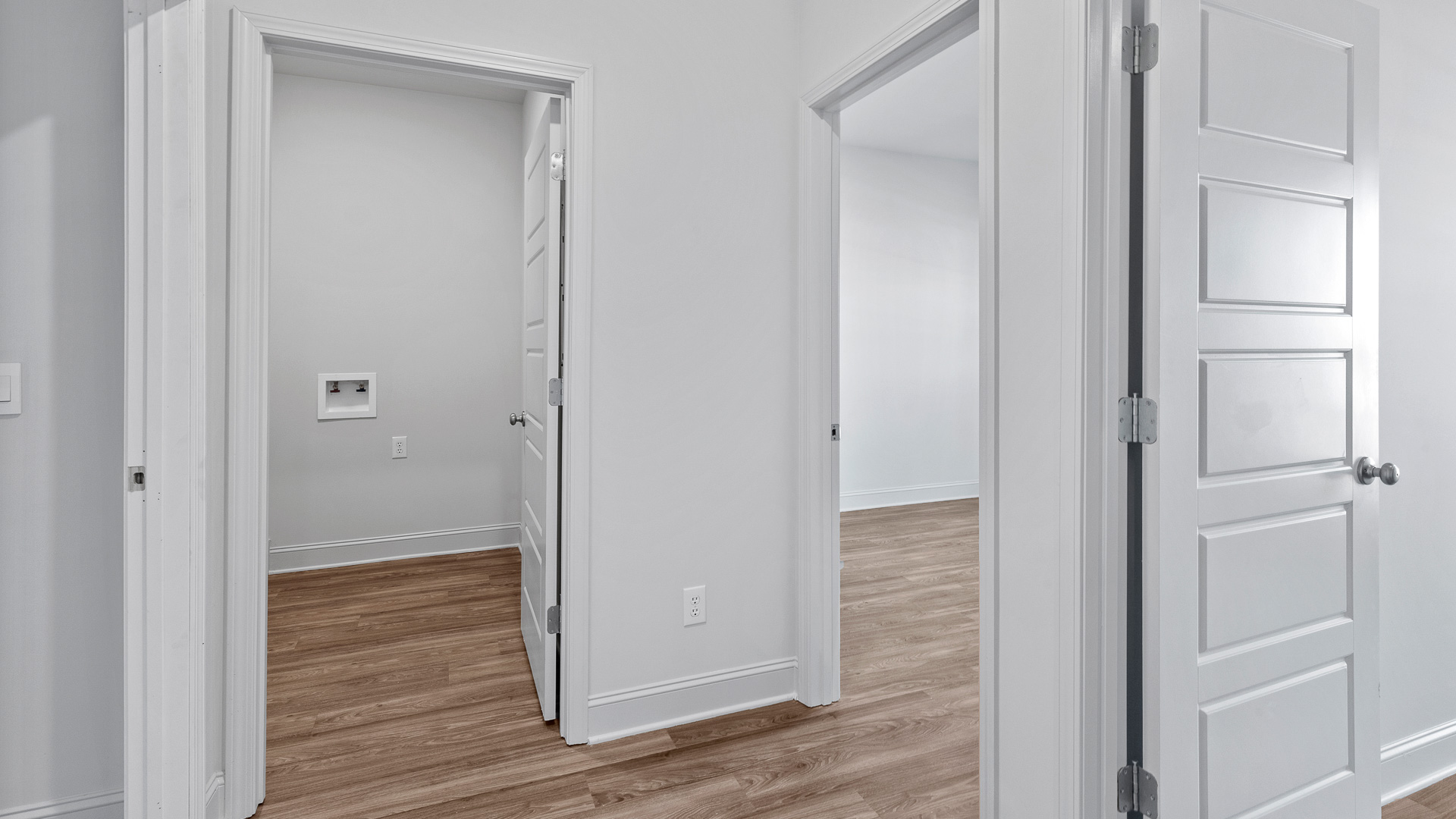 Spacious laundry area has room for a washer and dryer and bedrrom in the room over.