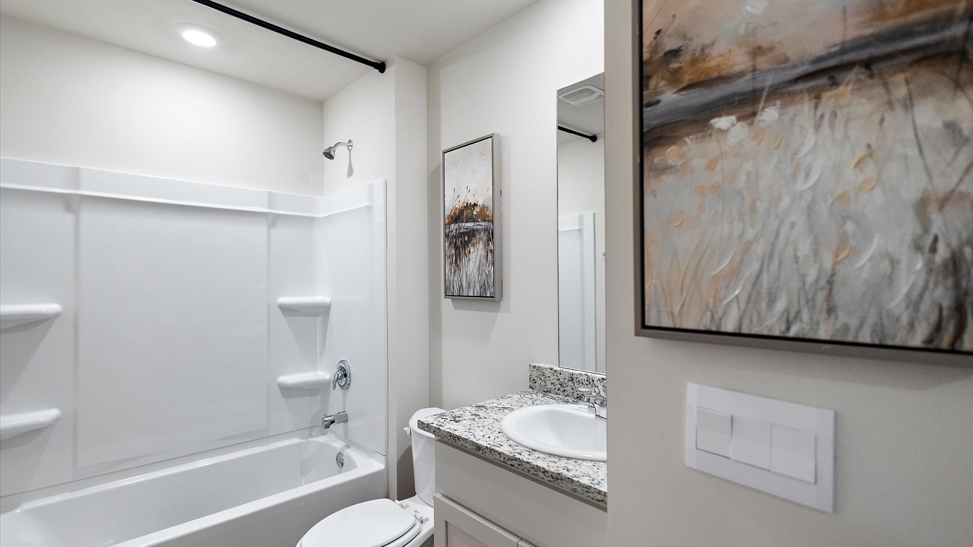 Hall bathroom with single vanity and shower/tub combo