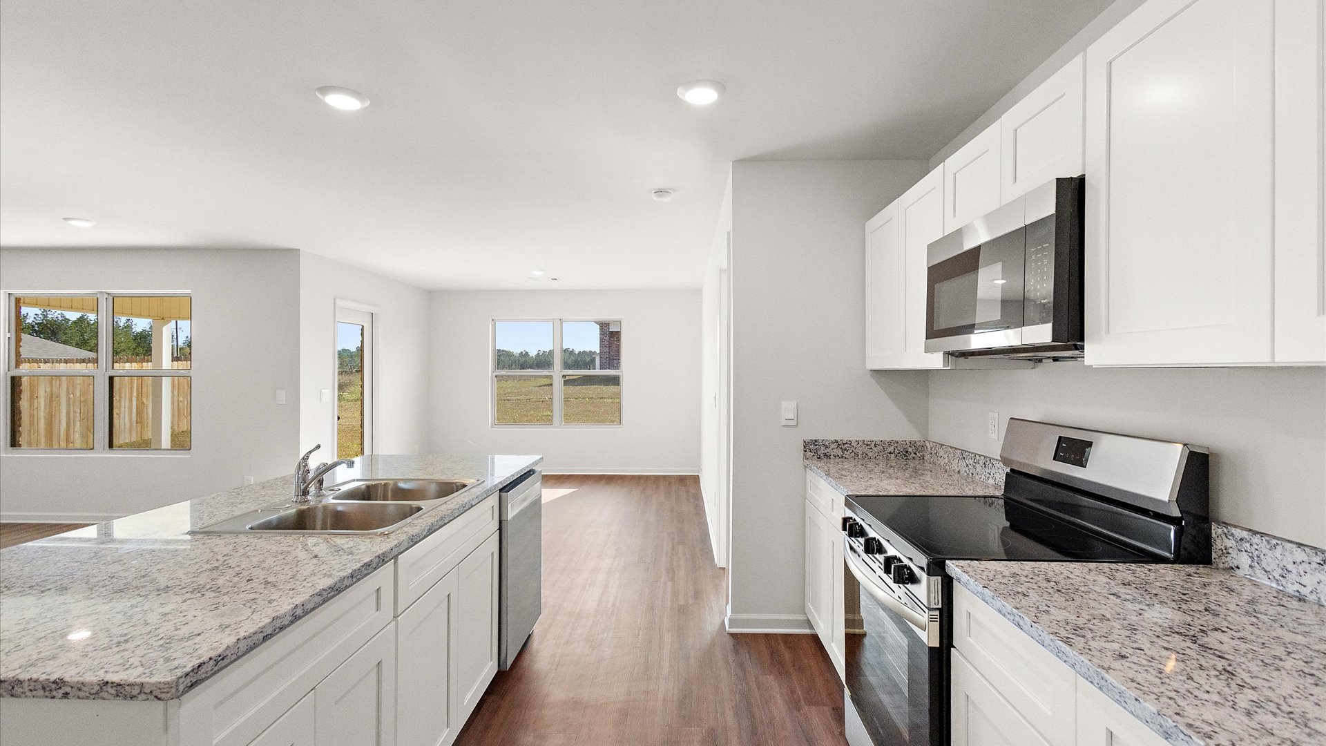 Kitchen with shaker style cabinets and stainless steel appliances