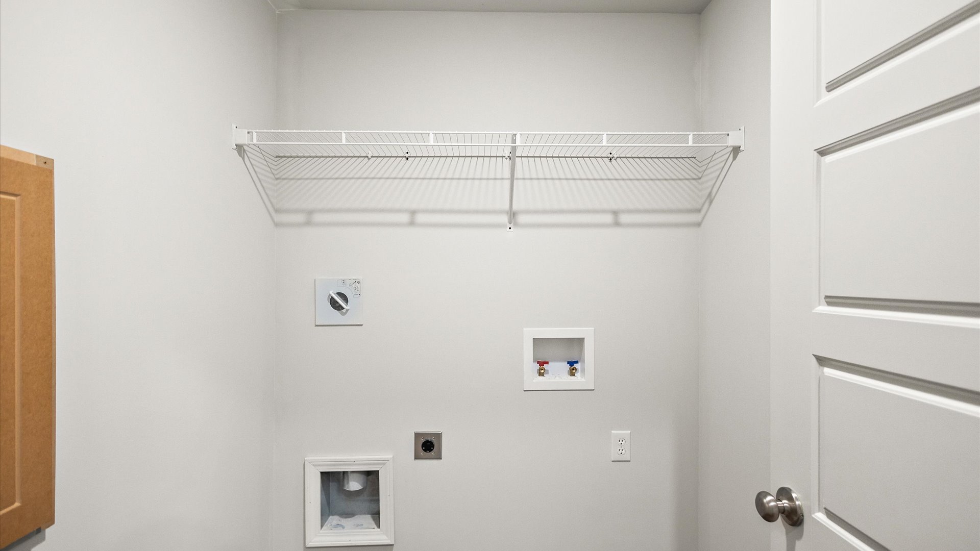 laundry room with wire shelving