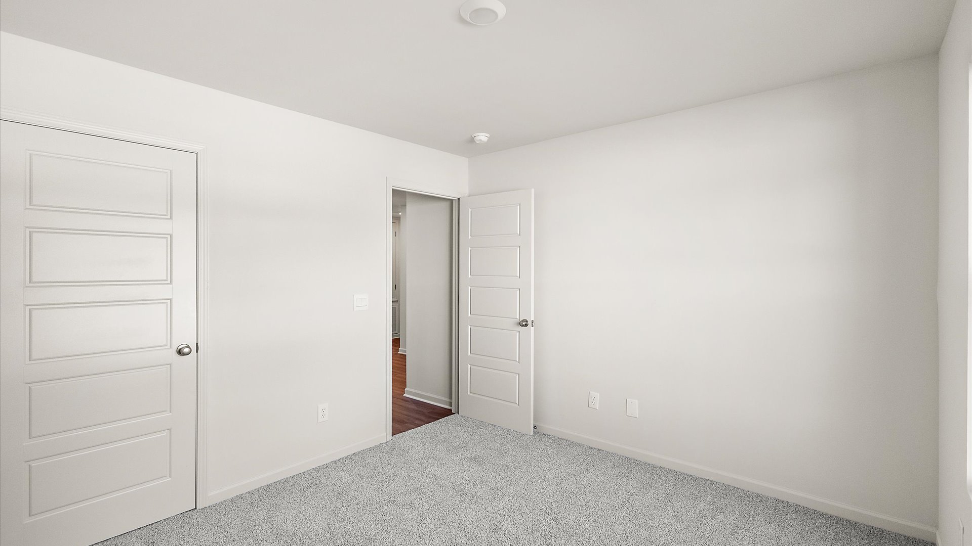additional bedroom with carpeted floors and window for natural light