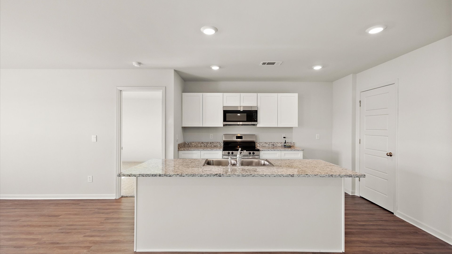 Kitchen with shaker style cabinets and stainless steel appliances