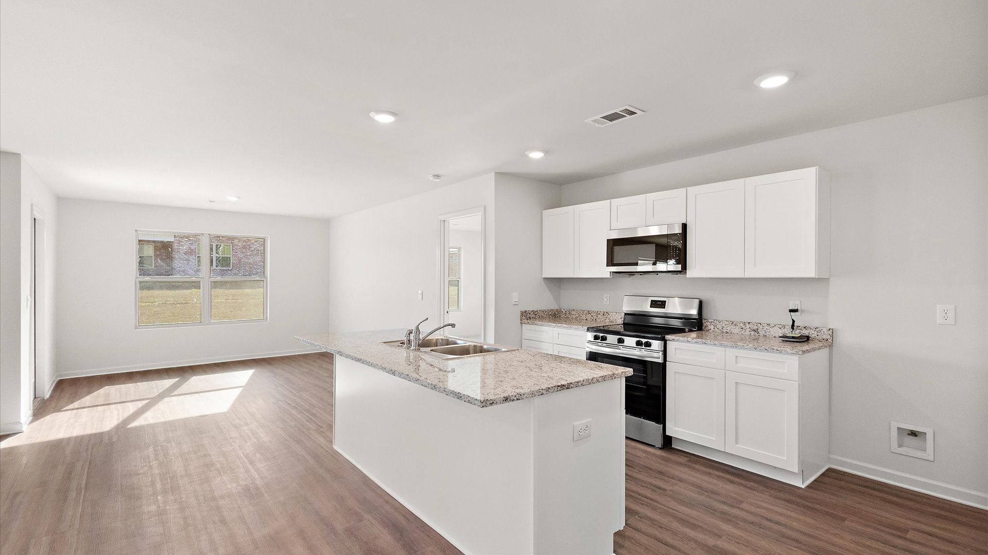 Kitchen with shaker style cabinets and stainless steel appliances