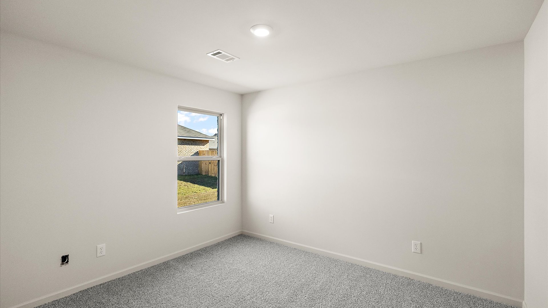 additional bedroom with carpeted floors and window for natural light
