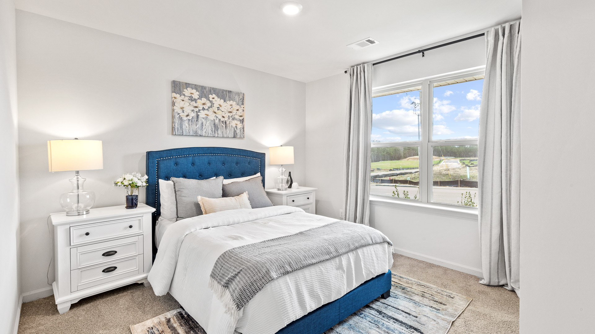 Bedroom 2 features neutral carpet with a double window.