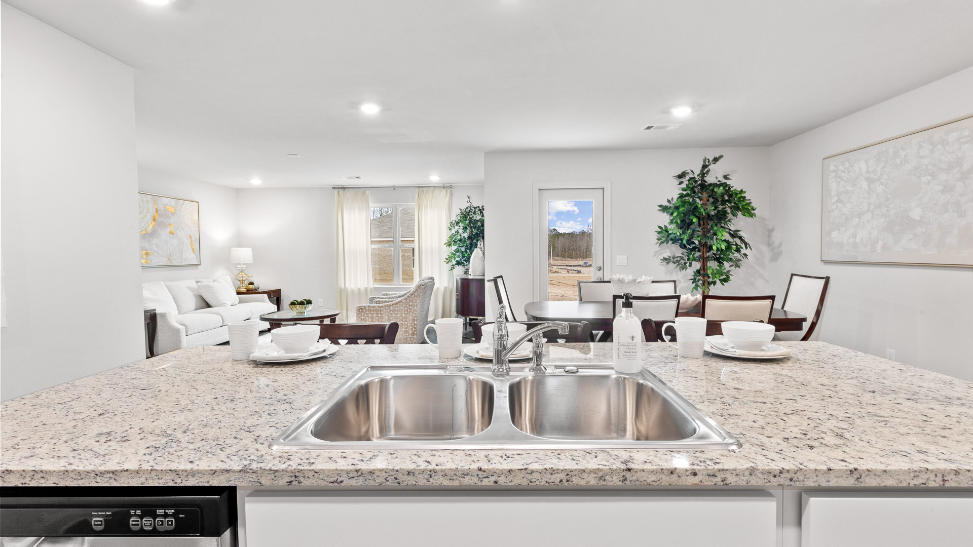 View of the dining room and the living room from the kitchen.