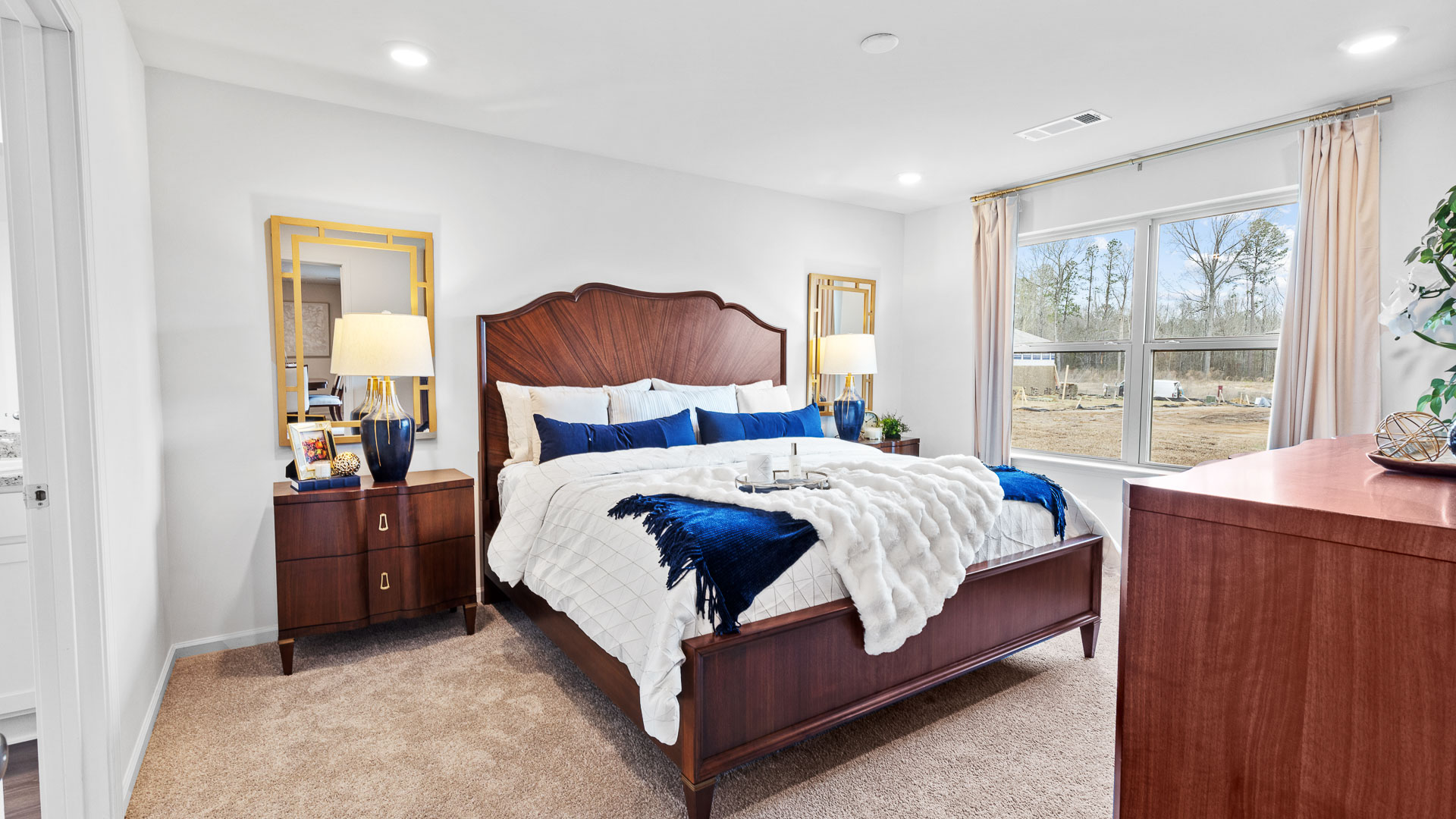 Bedroom 1 has a neutral carpet and a double window.