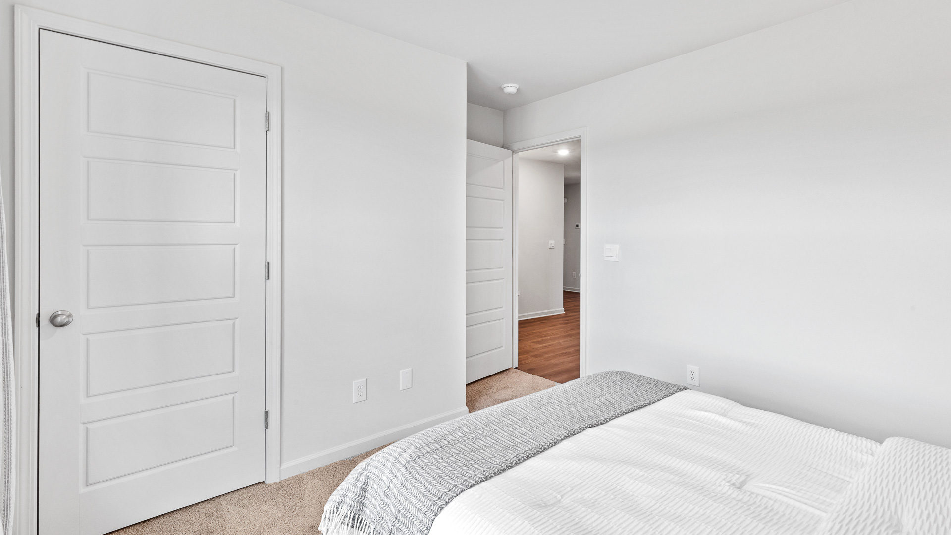 View from bedroom 2 showing the closet and the hallway.