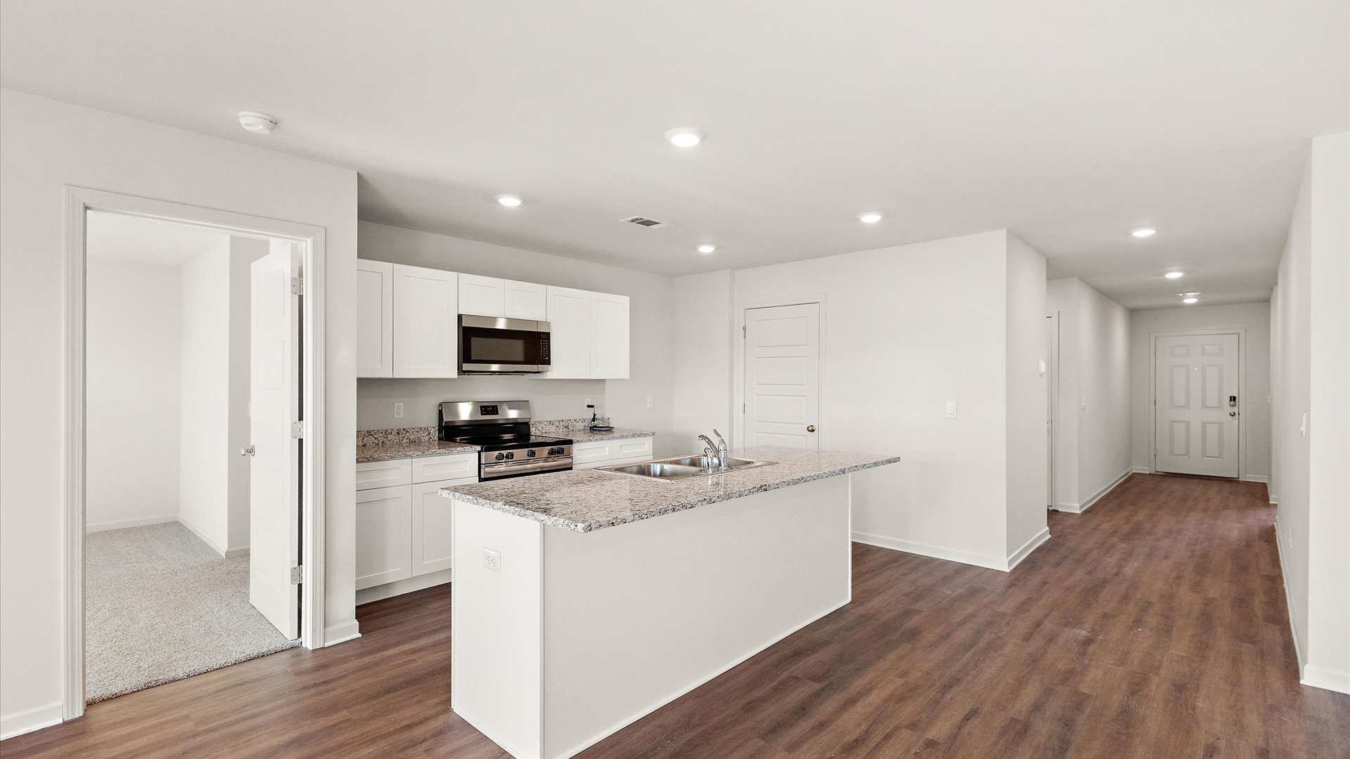 Kitchen with shaker style cabinets and stainless steel appliances