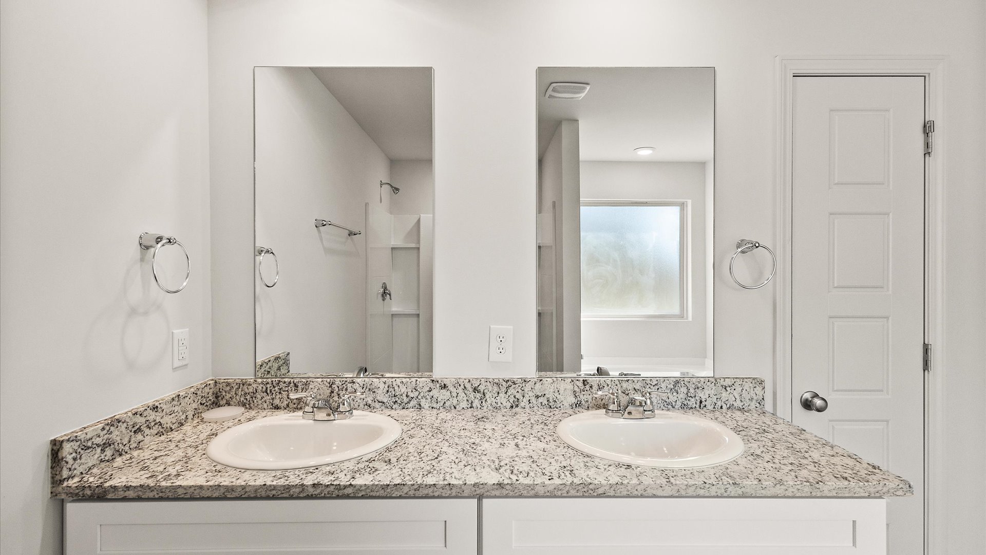 Primary bathroom with dual vanity