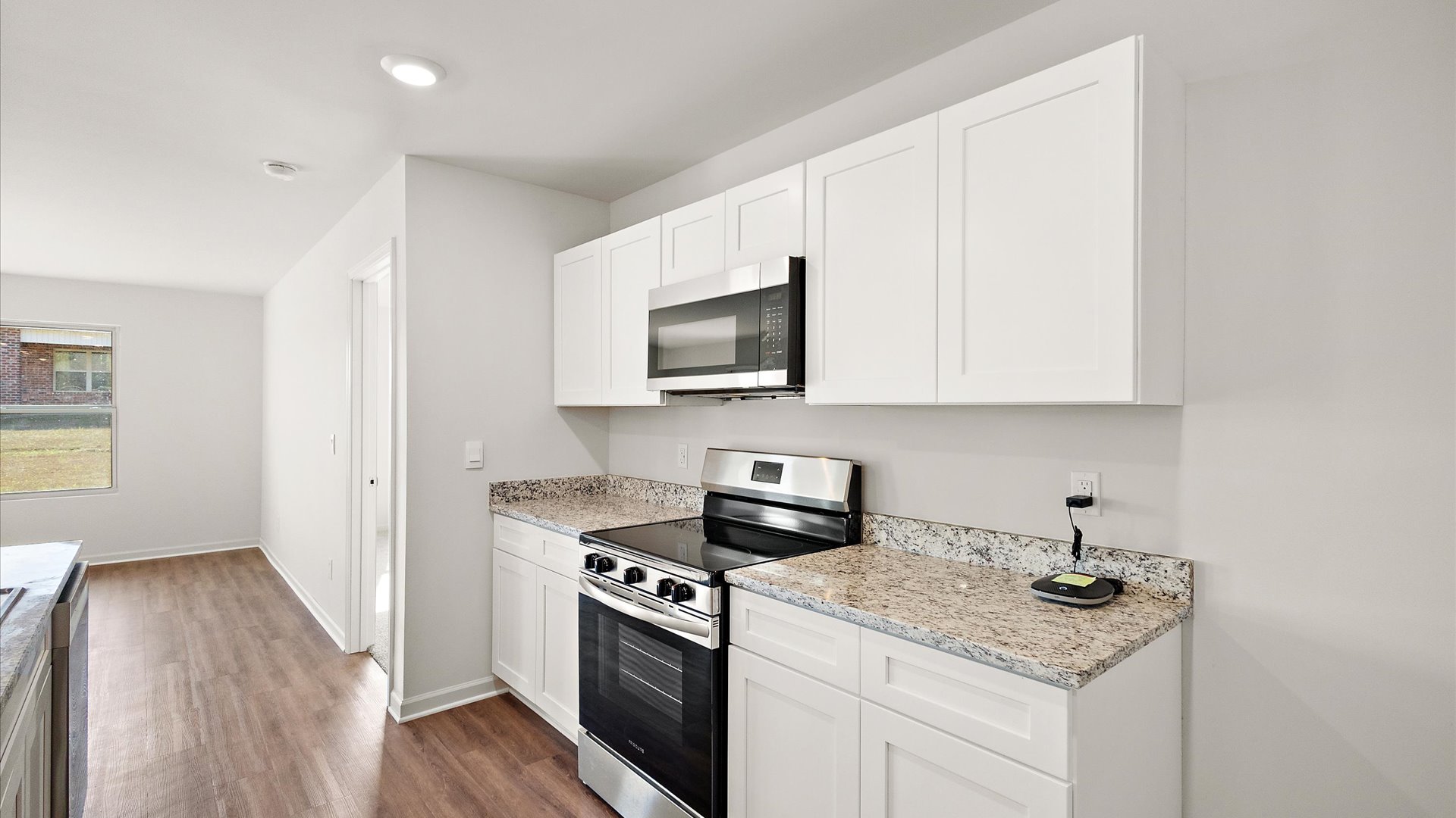 Kitchen with shaker style cabinets and stainless steel appliances