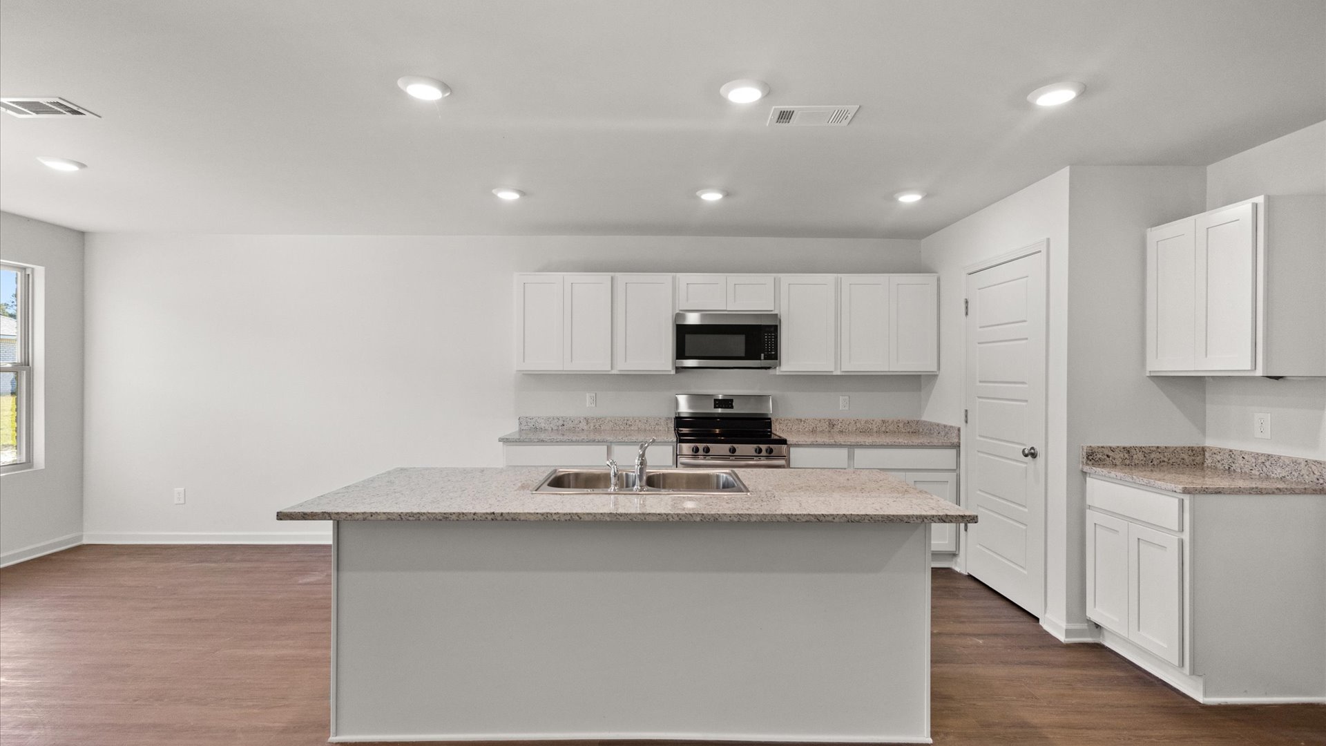 spacious kitchen with granite countertops and stainless steel appliances